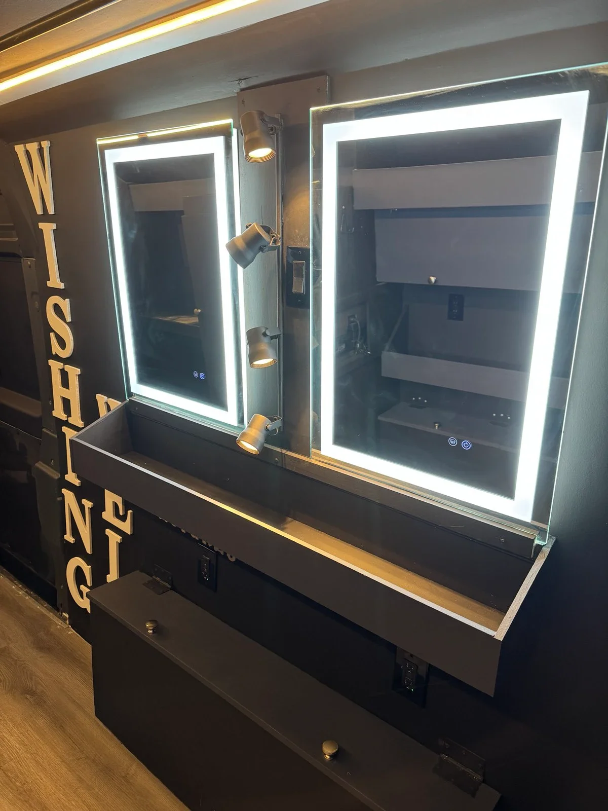 Two illuminated hair and makeup stations