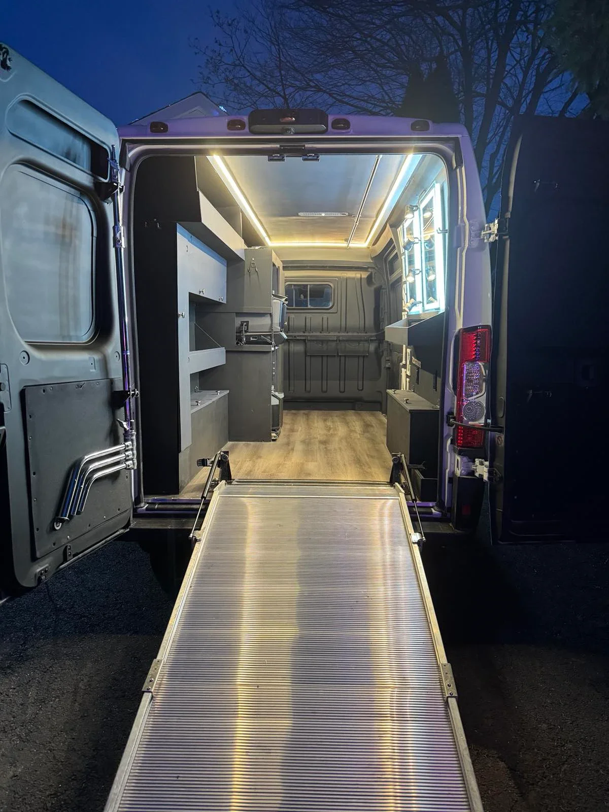 Spacious production van interior with rear loading ramp