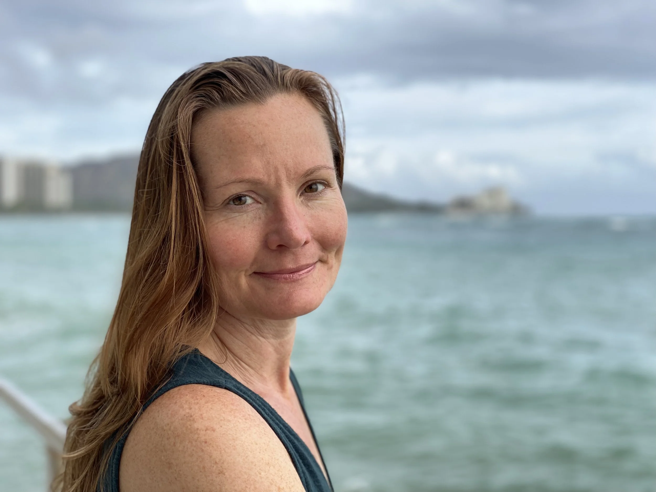 Jessica Steinbomer, Certified Hakomi Practitioner and somatic educator in Austin, smiling outdoors