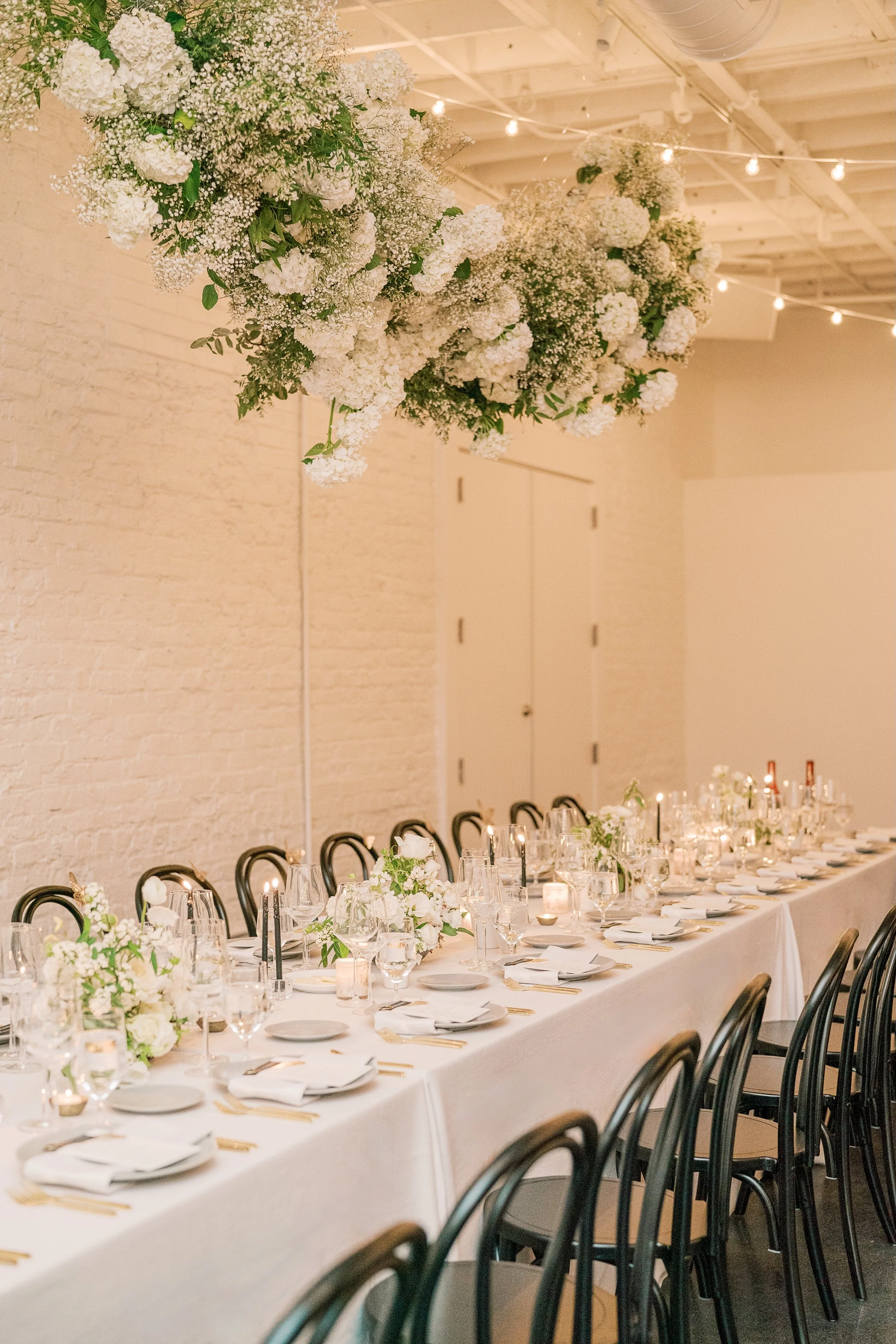 classic, modern, and chic black tie wedding table with floral installation from amy osaba in Raleigh, North Carolina.