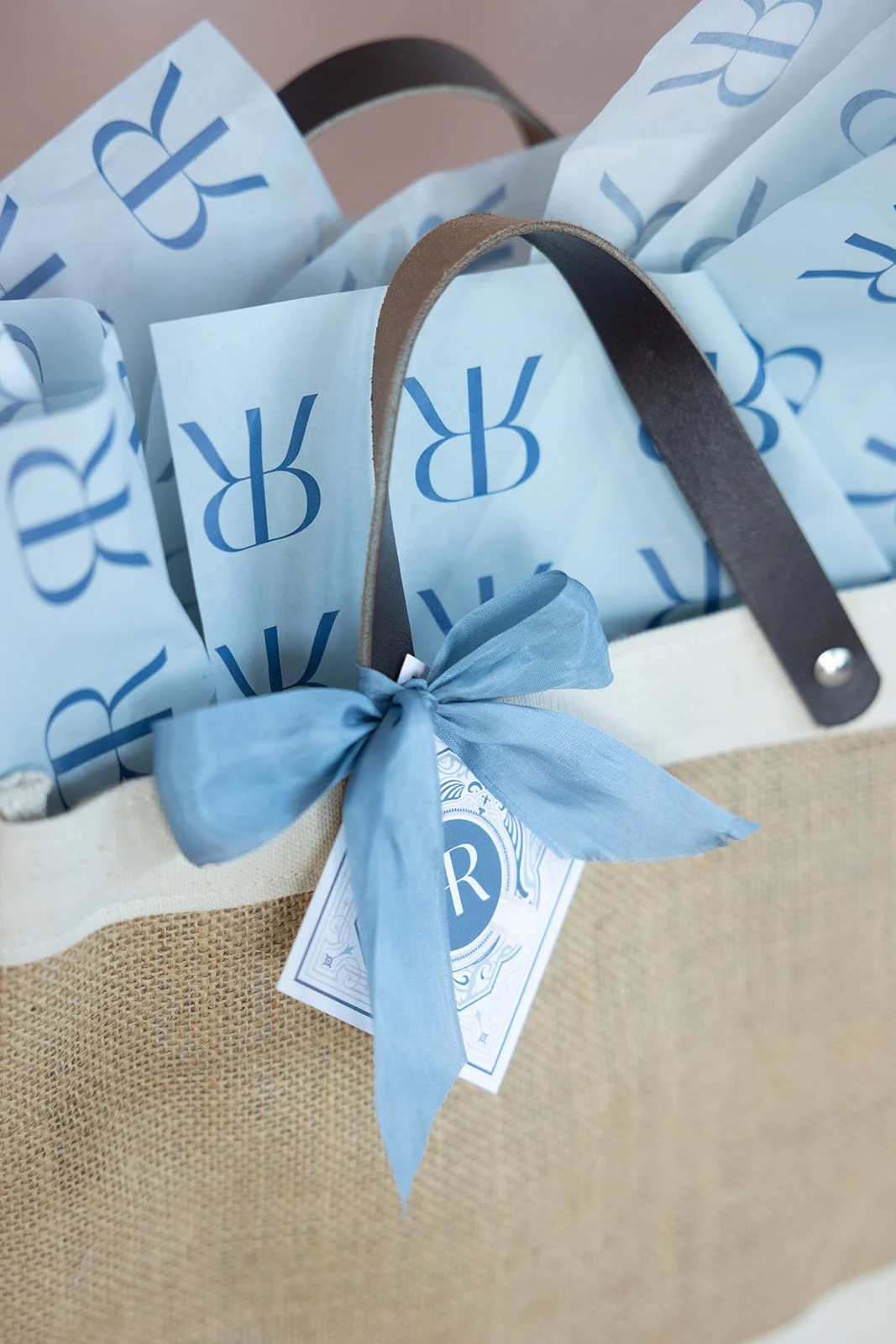 custom wedding welcome gift, a signature welcome, custom tissue paper, weddging welcome bag, wedding invitation flatlay wedding invitations flatlay, stationery flatlay, wedding stationery, flatlay photography, wedding photography, luxury wedding, inv