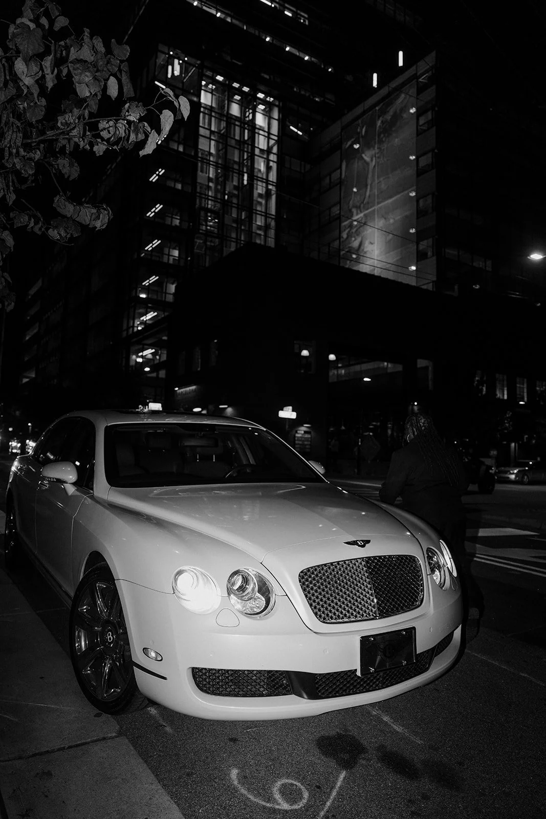 Bride and groom make a stylish exit in a Rolls-Royce Ghost getaway car