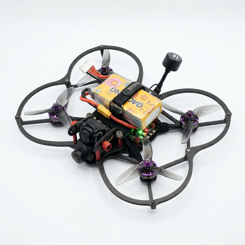 A racing drone with four propellers, a camera, and a battery mounted on top, against a white background.