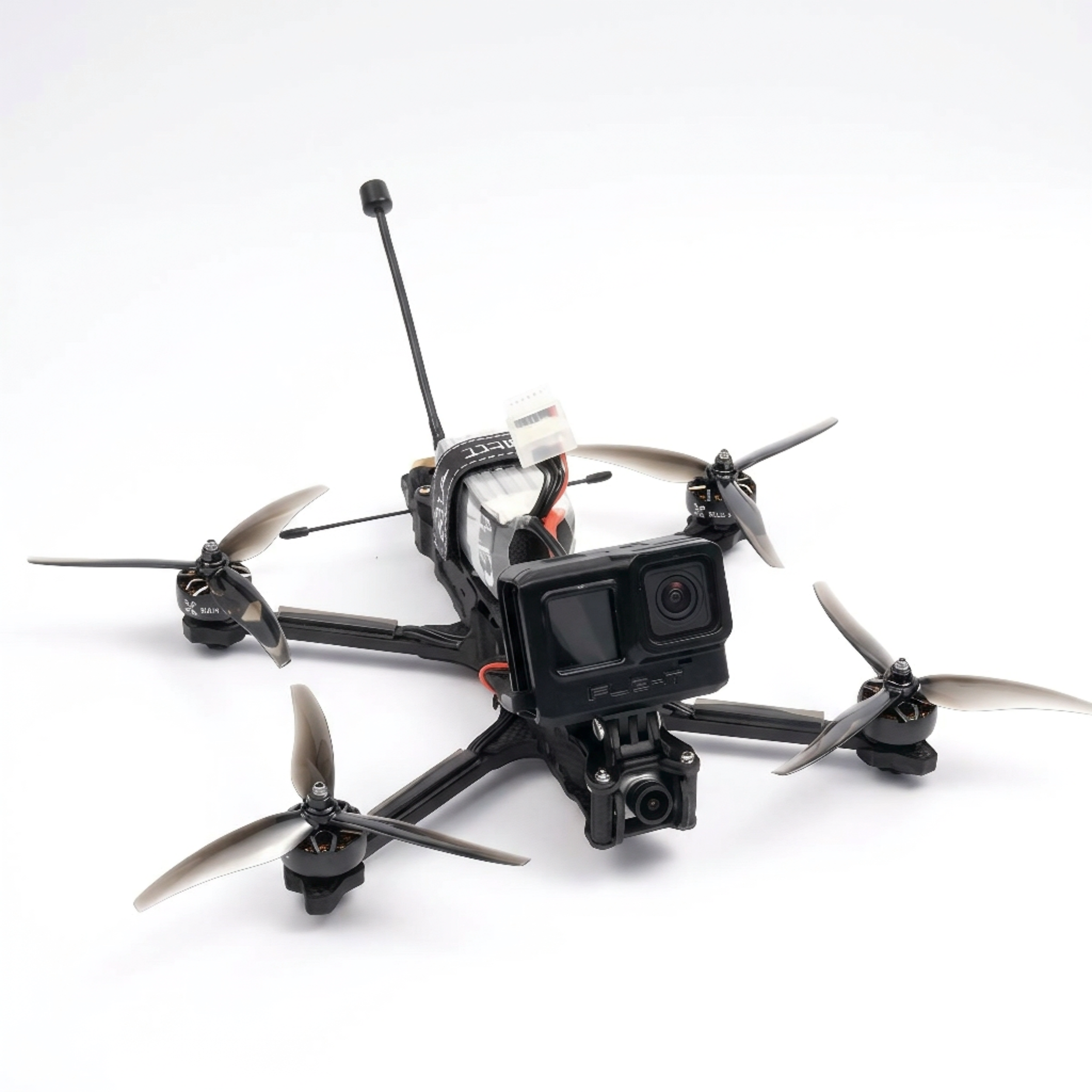 A black quadcopter drone with four propellers and a mounted camera on a white background.