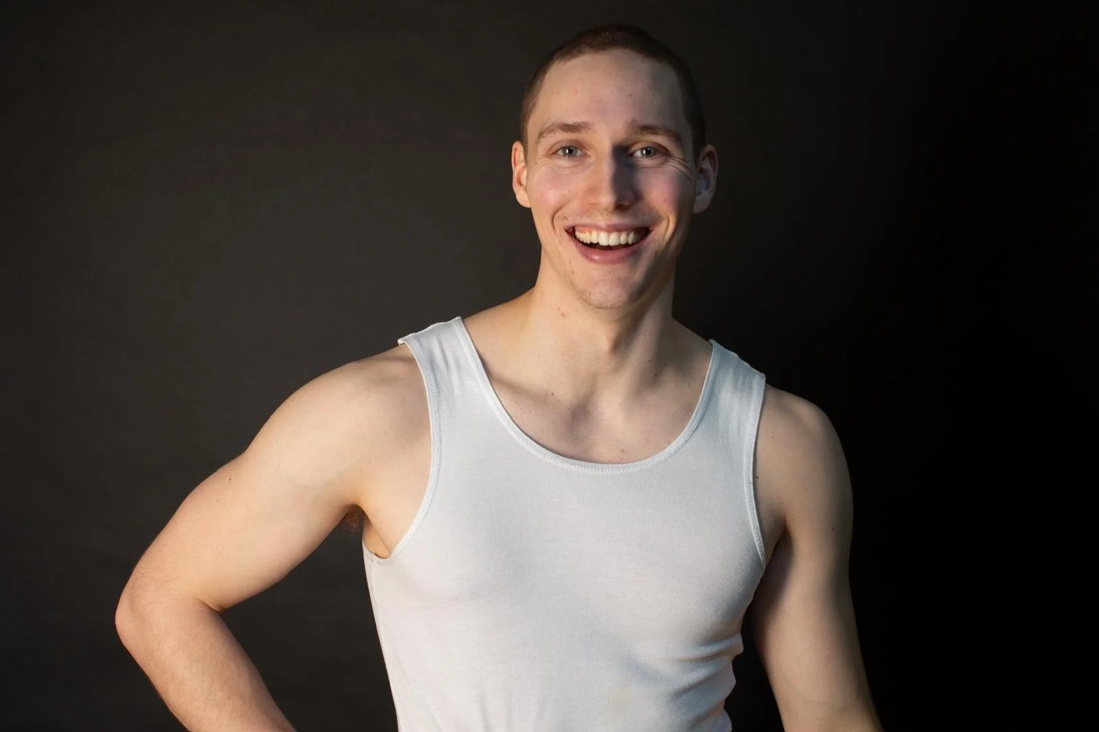 Griffin is pictured in a white singlet against a black background