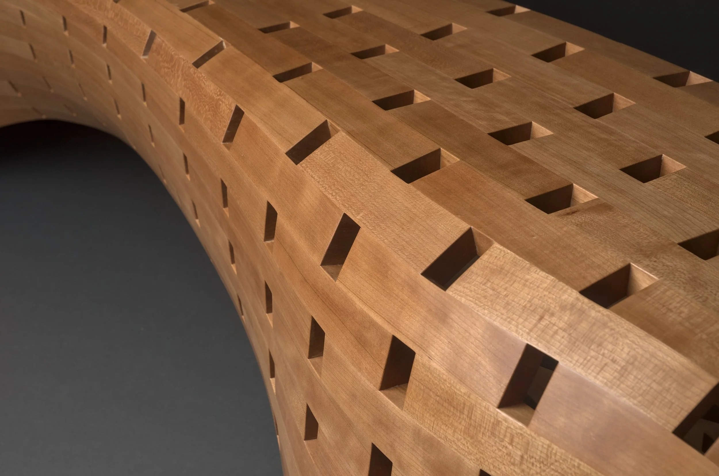 Detail view of Peanut Bench showing bricked coopering up close