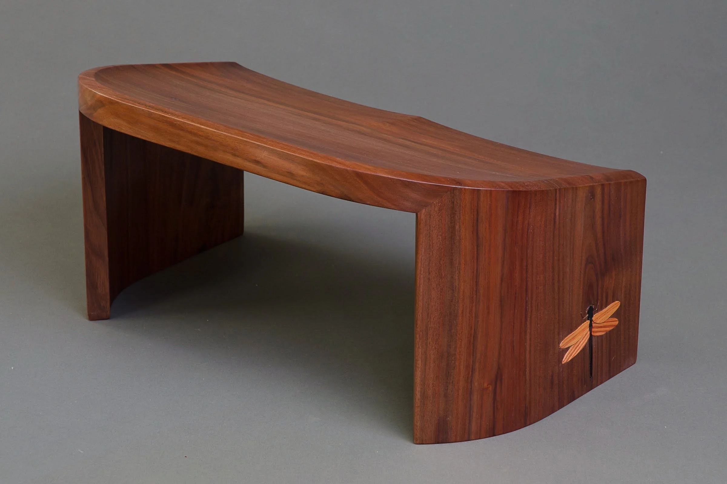 Dragonfly Kneeling Stool, three-quarter view from back with carving visible