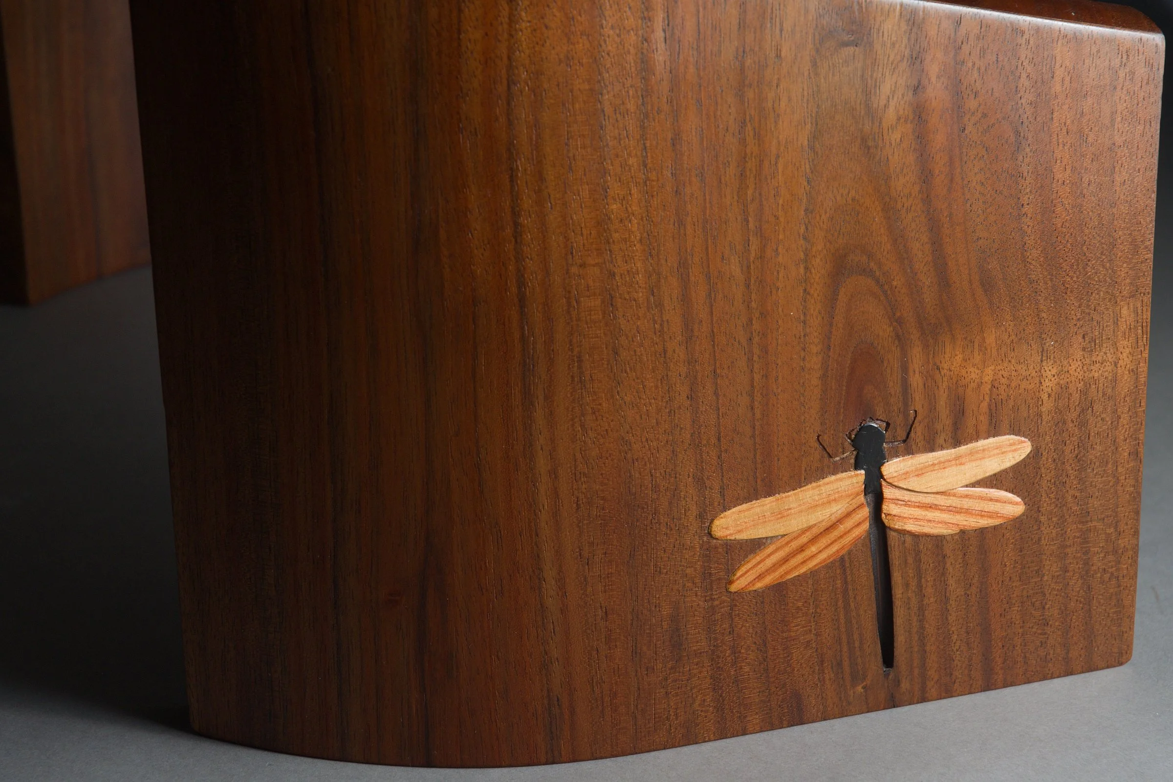Dragonfly Kneeling Stool, detail view of carving