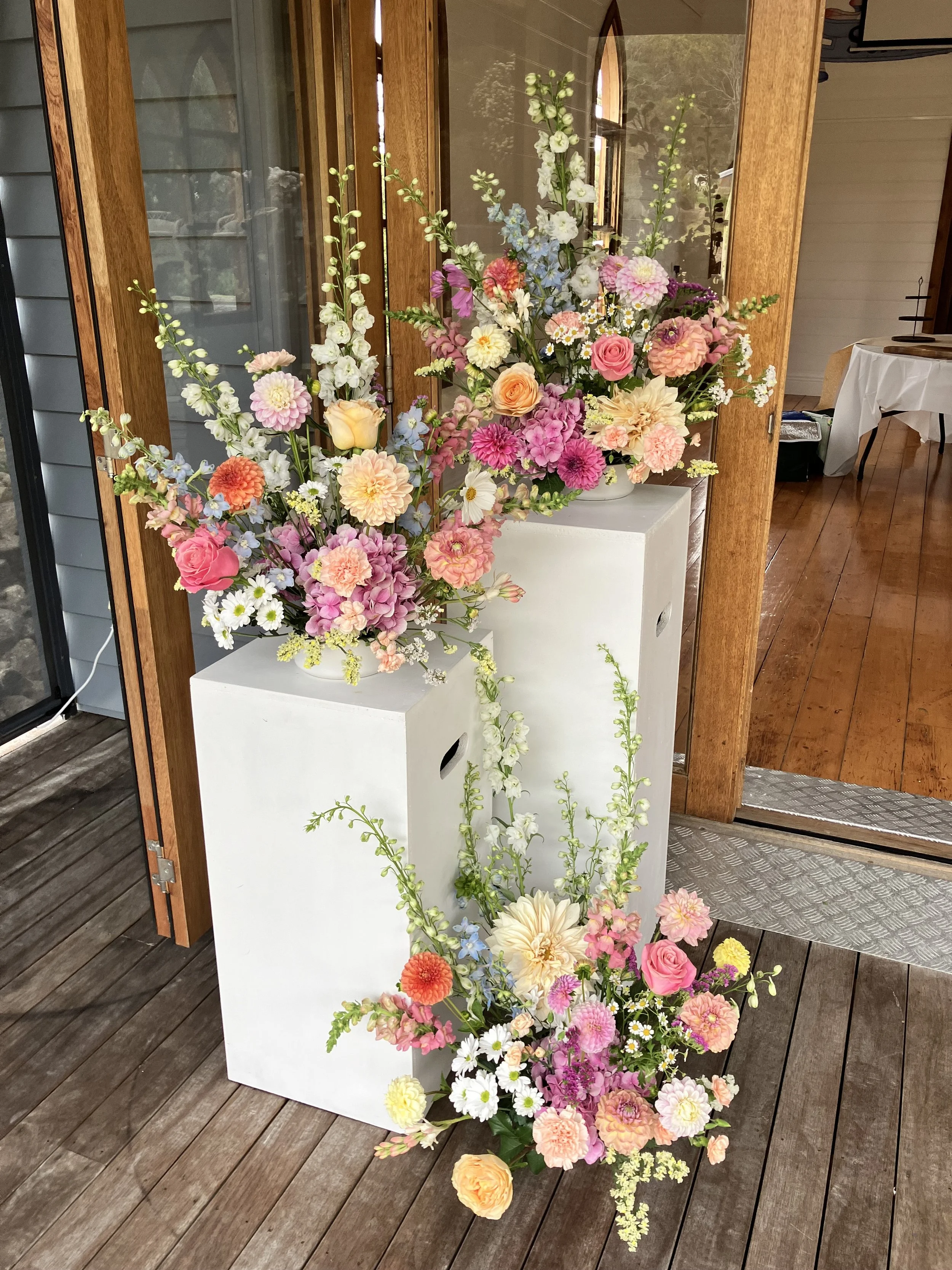 Left - hand side Ceremony Arrangements - Dahlias, Delphiniums, Roses, Hydrangea, Snapdragons, Matricaria, Status & Carnations