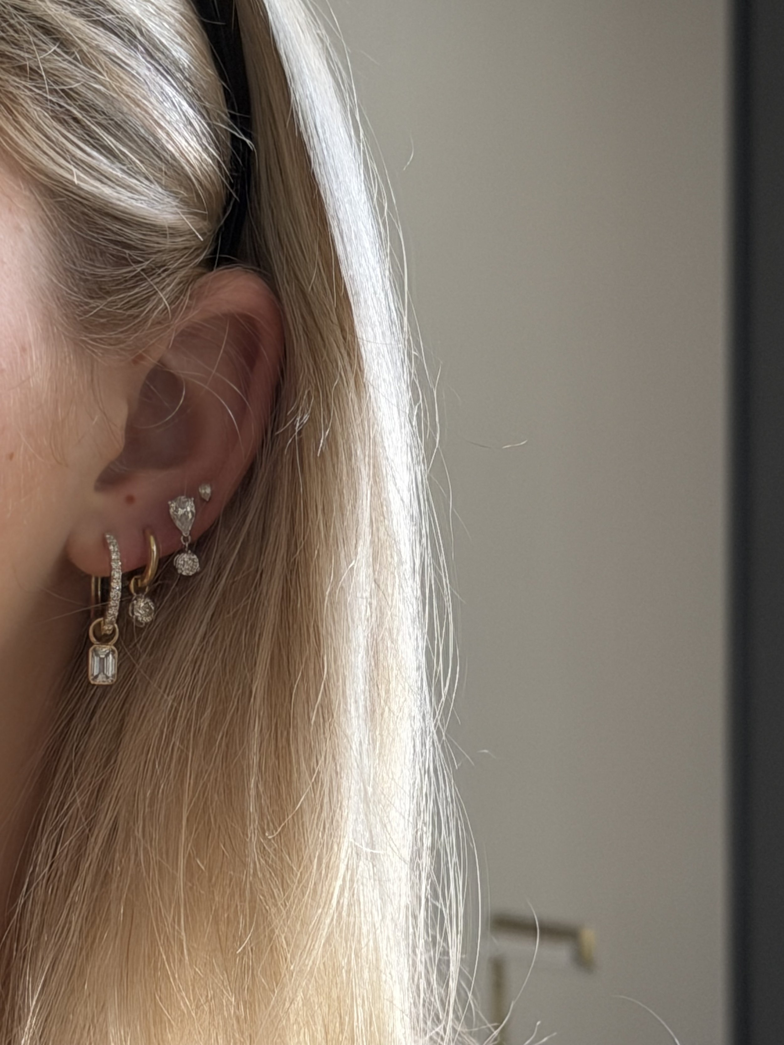 Pave hoops with dangling emeralds