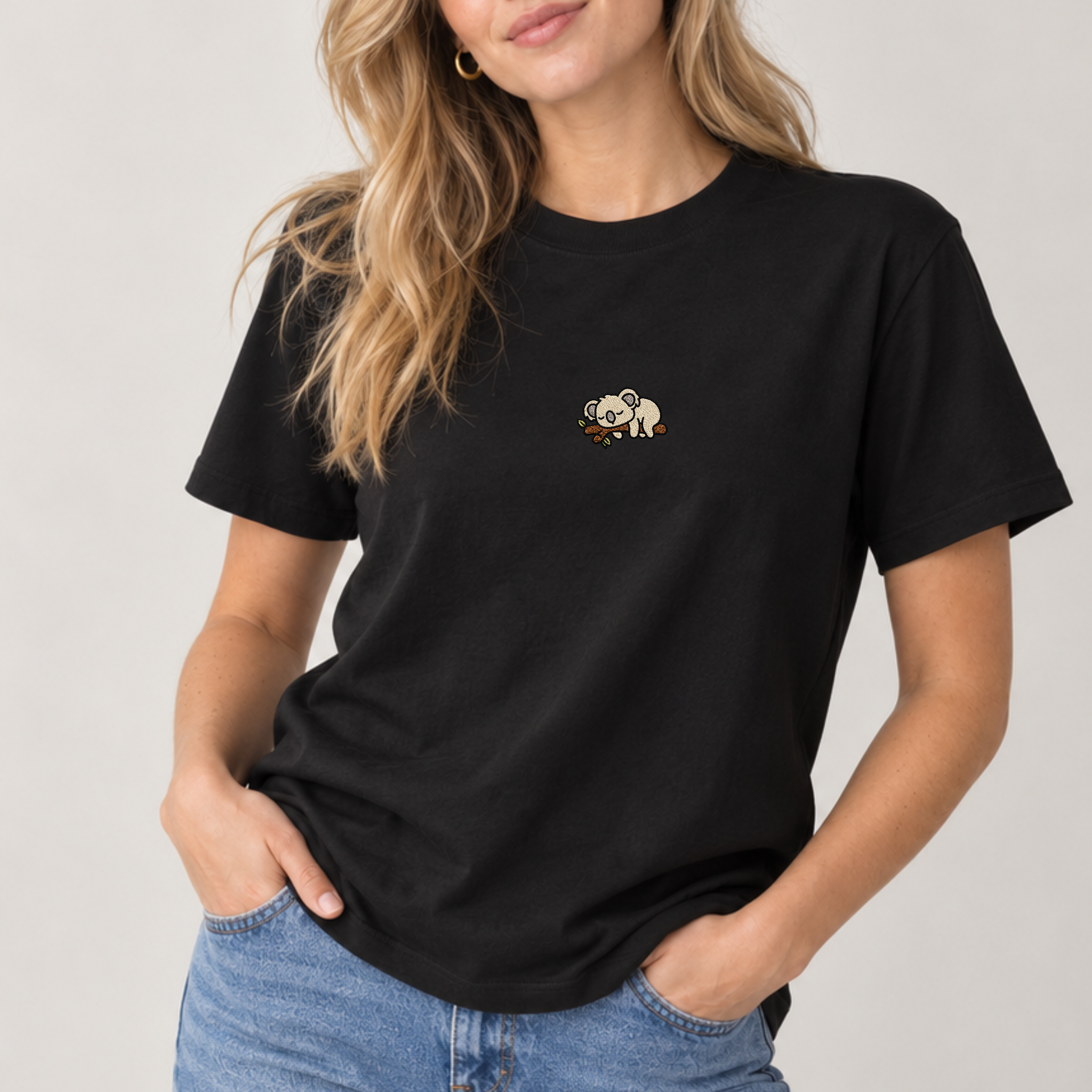 Women’s black embroidered koala T-shirt with small sleeping koala design on the chest
