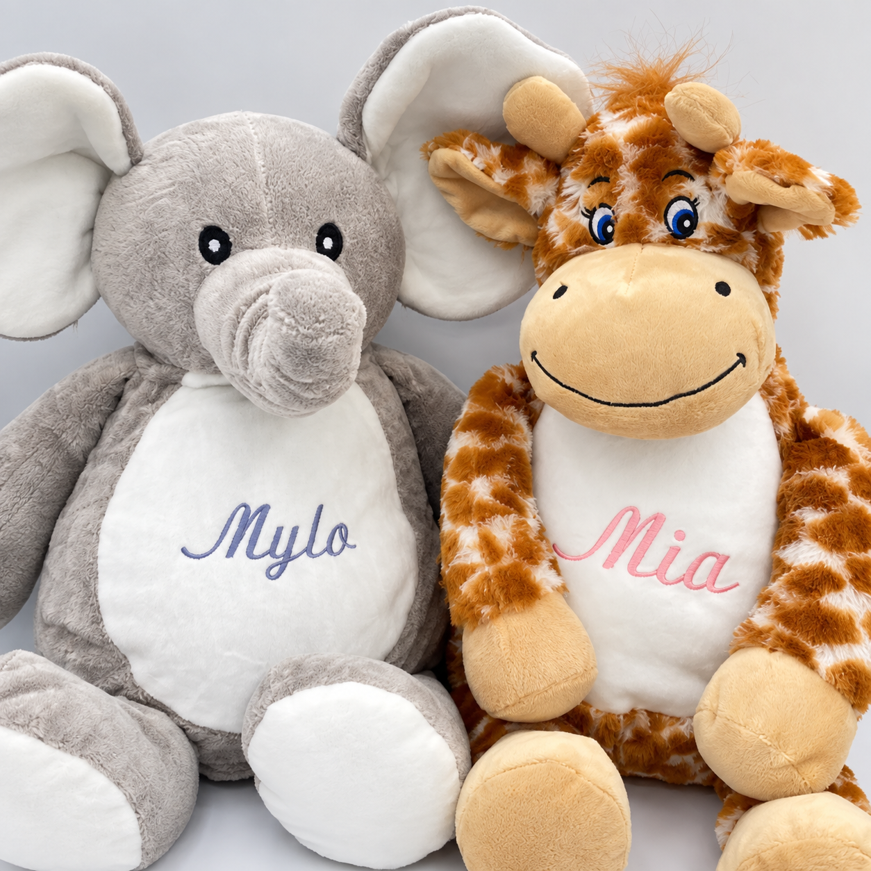 Personalised embroidered elephant and giraffe soft toys with custom names Mylo and Mia