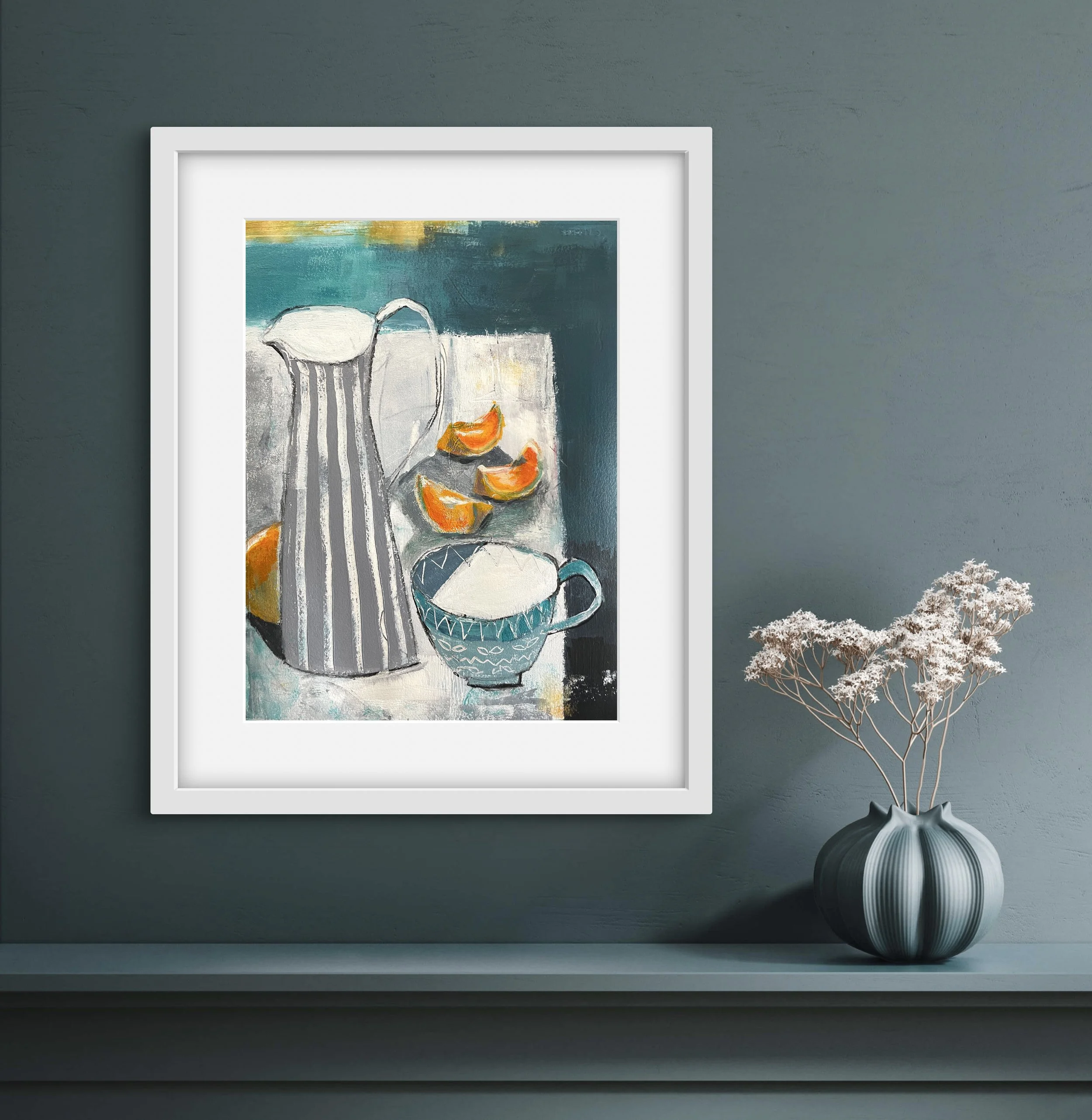 An original abstract still life painting of orange segments and a striped pitcher hanging on a wall