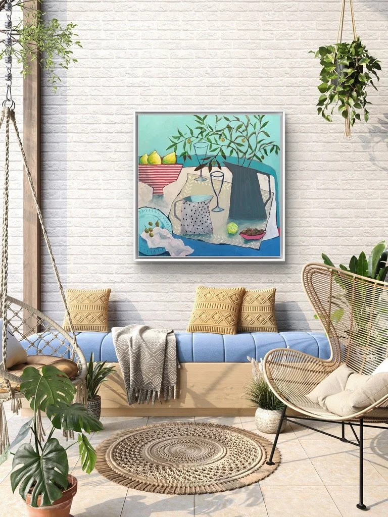 A beautiful still life painting in modern mediterranean style, hanging on a wall above a comfy, laid-back seating arrangement