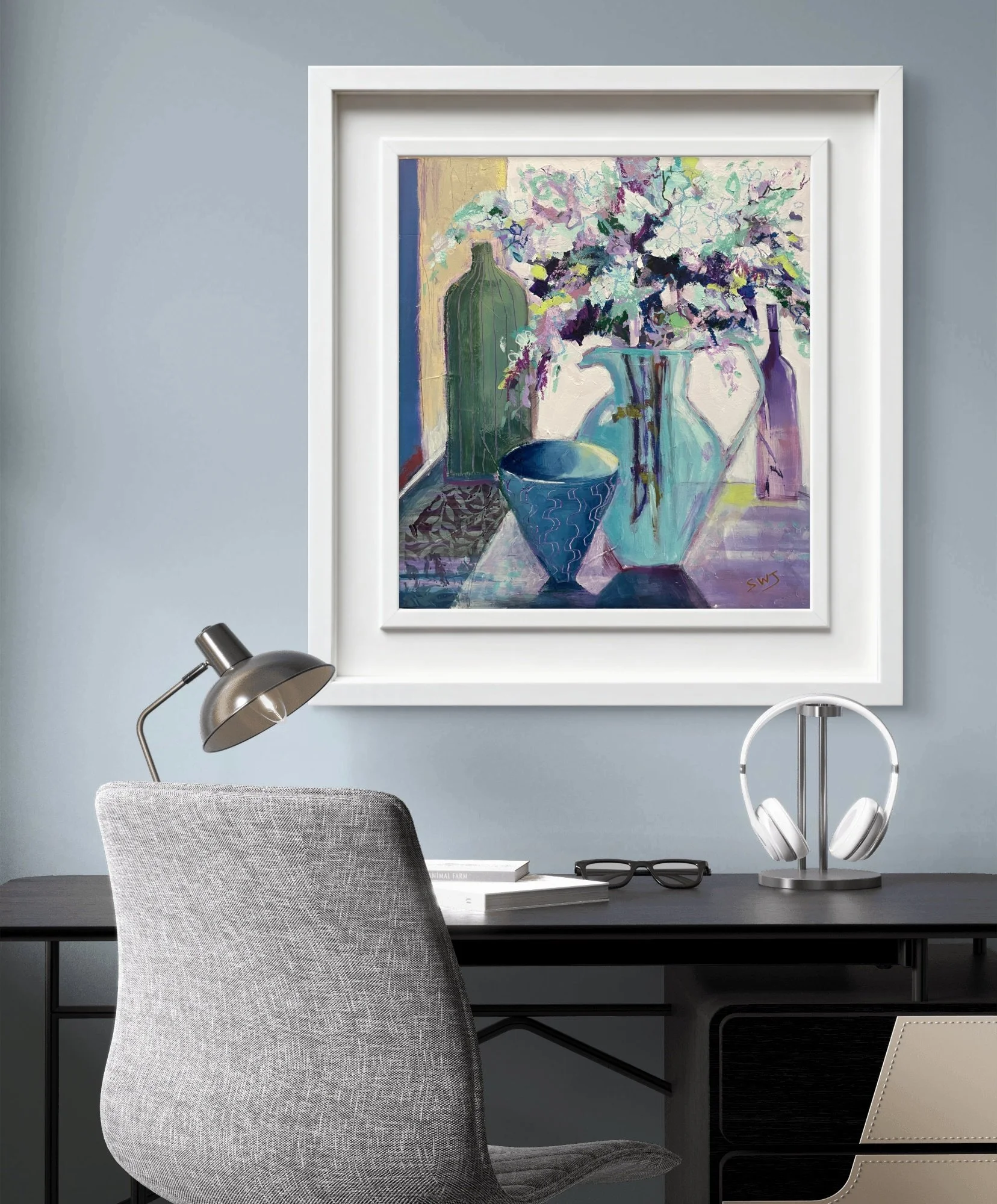 Hanging on the wall above a desk, a painting of flowers in a jug in shades of turq, blue and amethyst by Shani Wray-Jenkins
