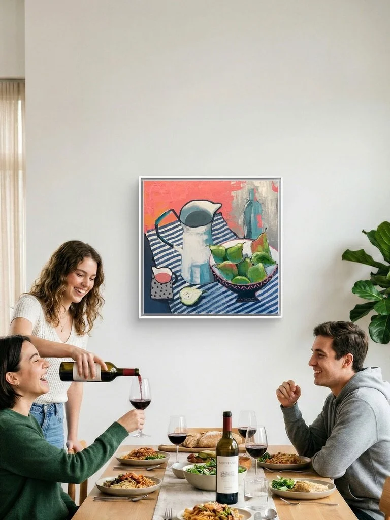A dining room with people eating and drinking, on the wall is a lovely still life painting of an old French pitcher with a dish of pears and a blue stripe tablecloth