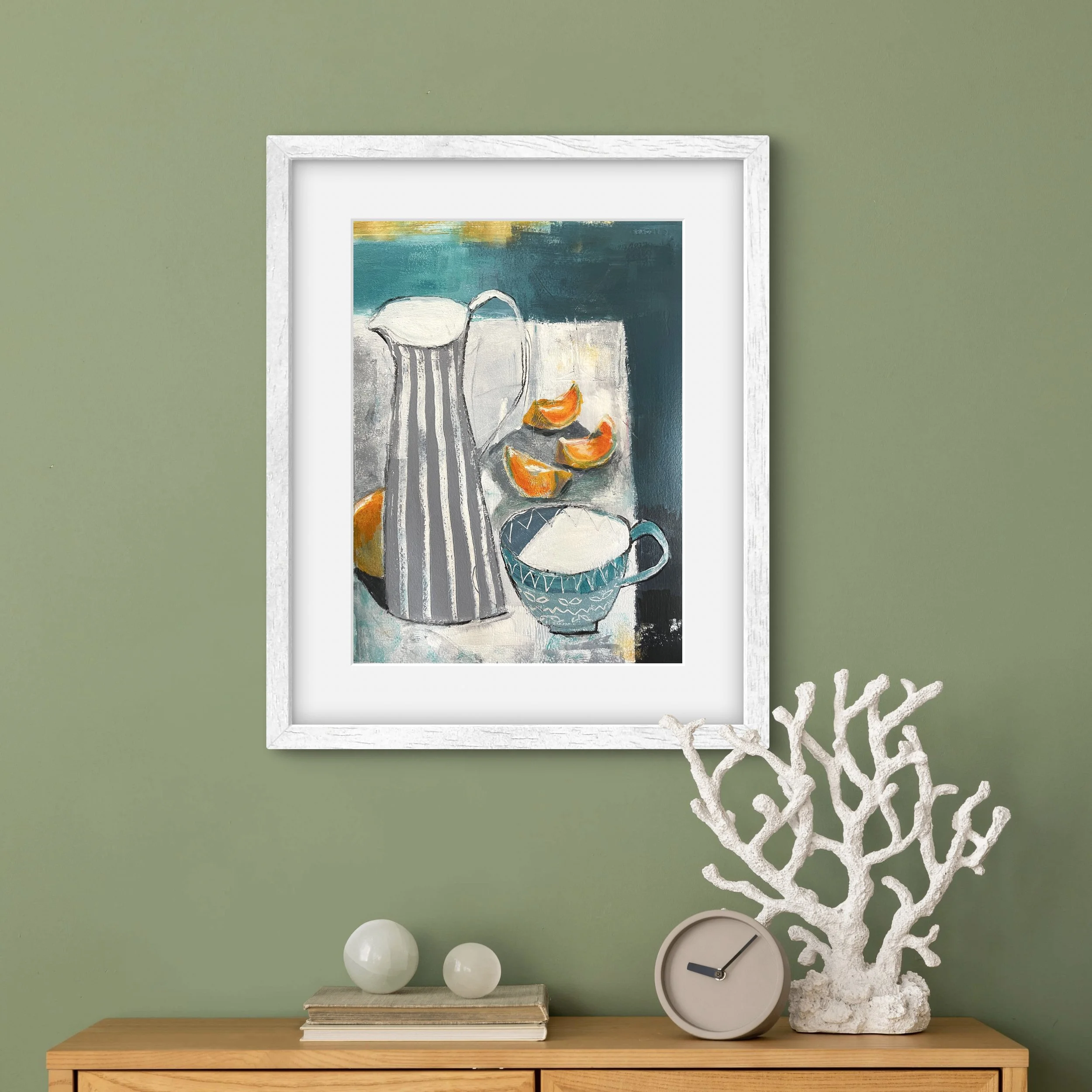 Painting of a jug and orange segments shown hanging against a green painted wall