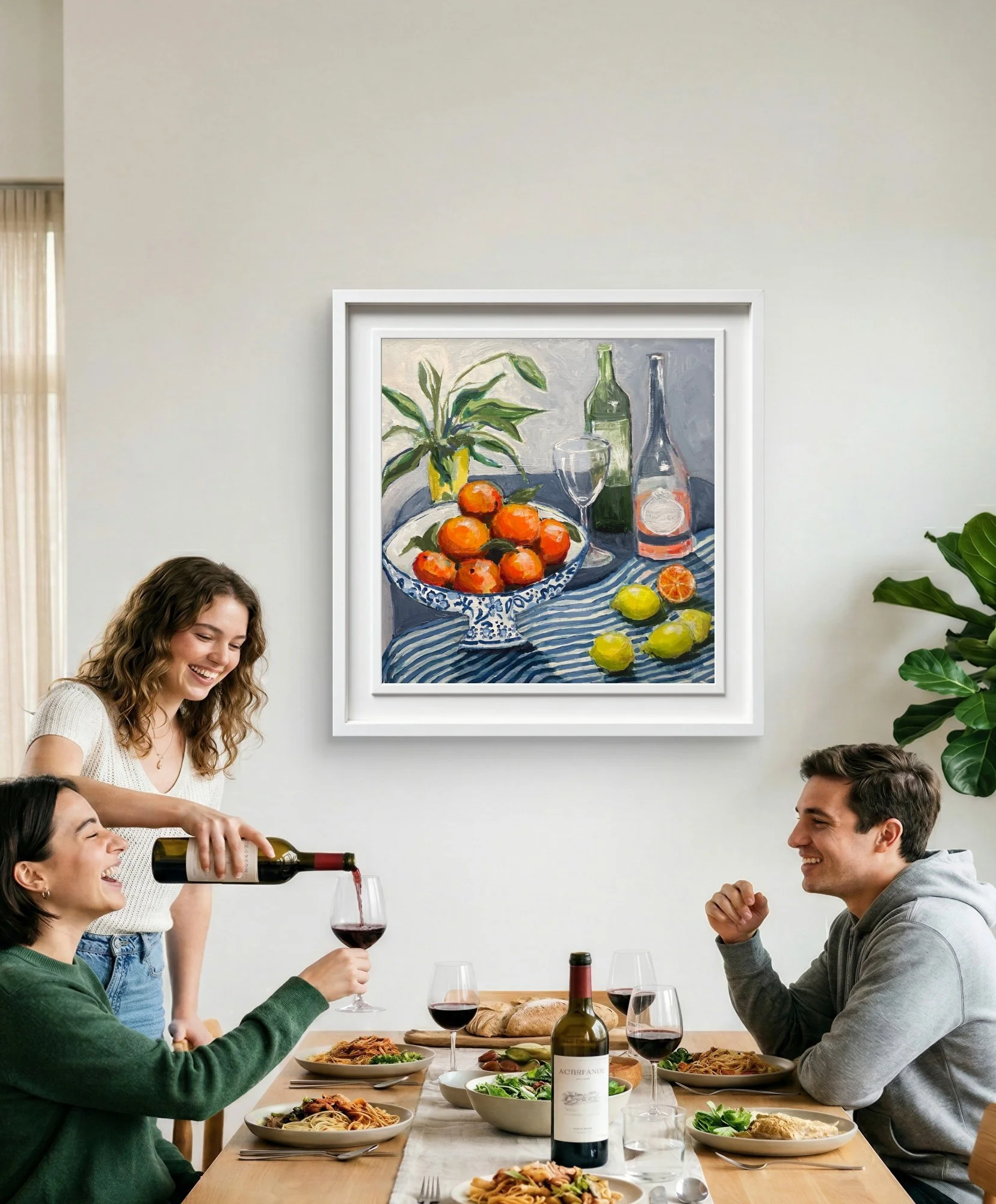 A dining room with 3 people and a still life painting of citrus fruits and wine by Shani Wray-Jenkins on the wall behind them.