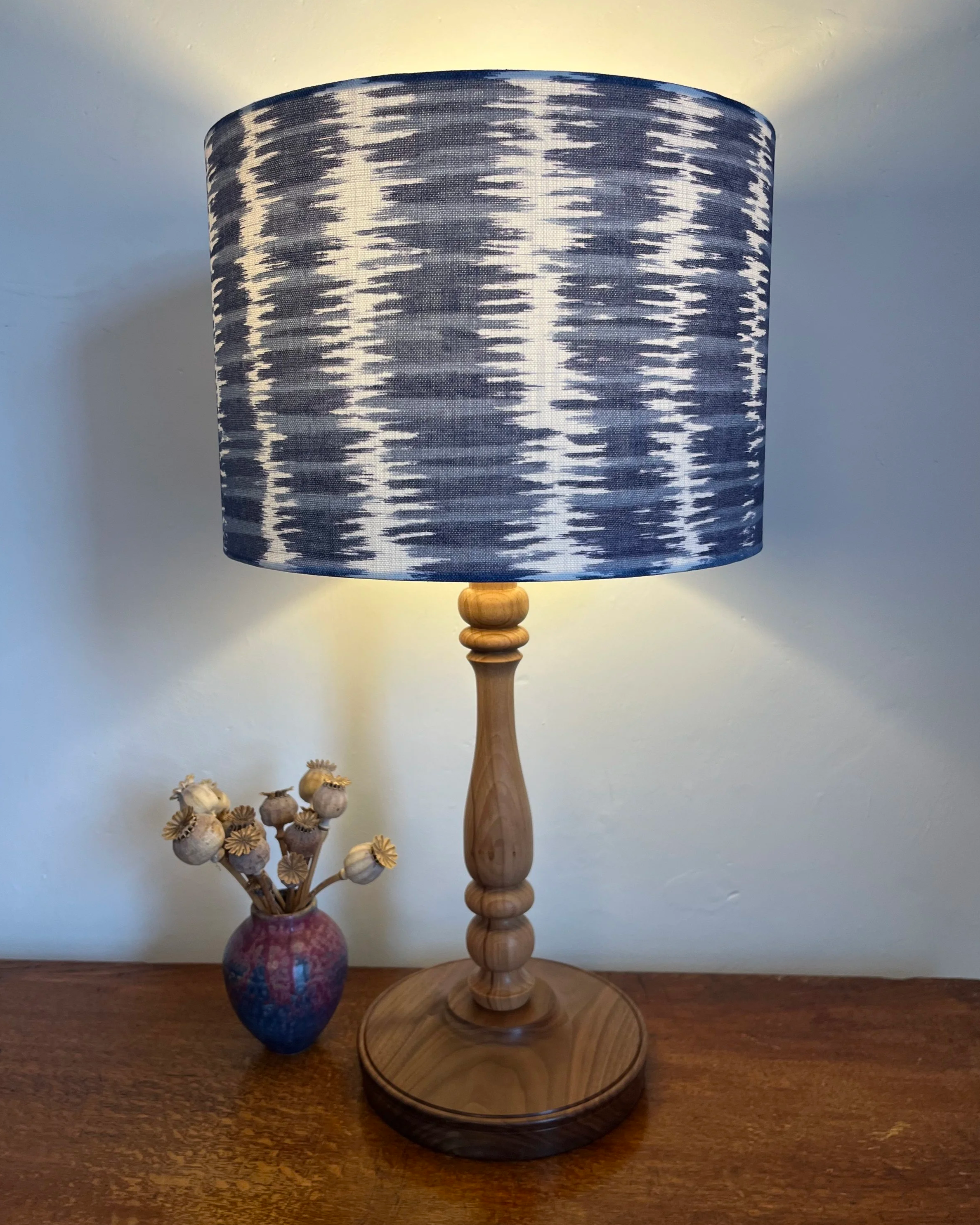 Blue and white striped lampshade, design looks like moonlight on ripplesd water