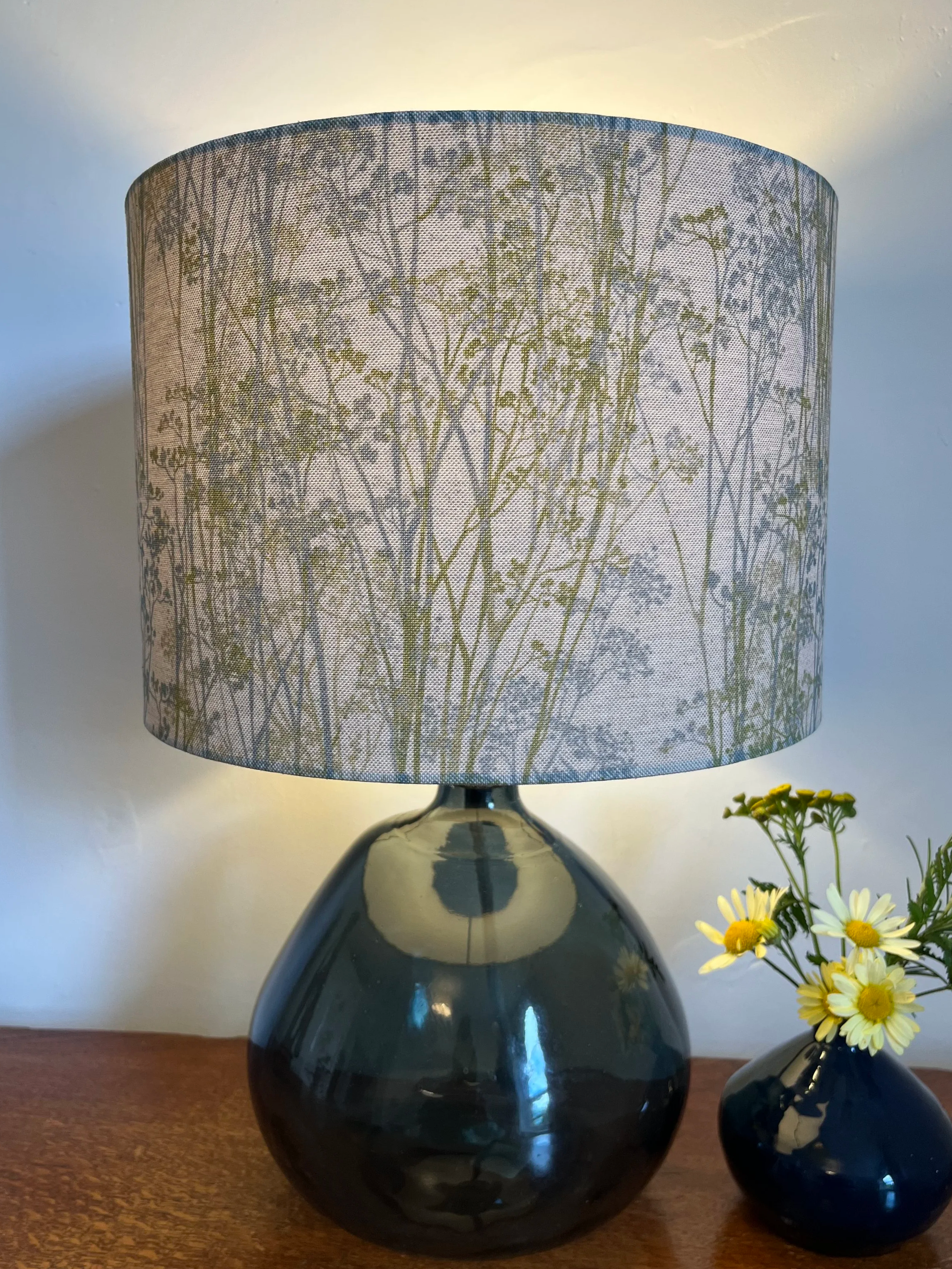 Hedgerow lampshade with grasses in blue and green on a natural beige background