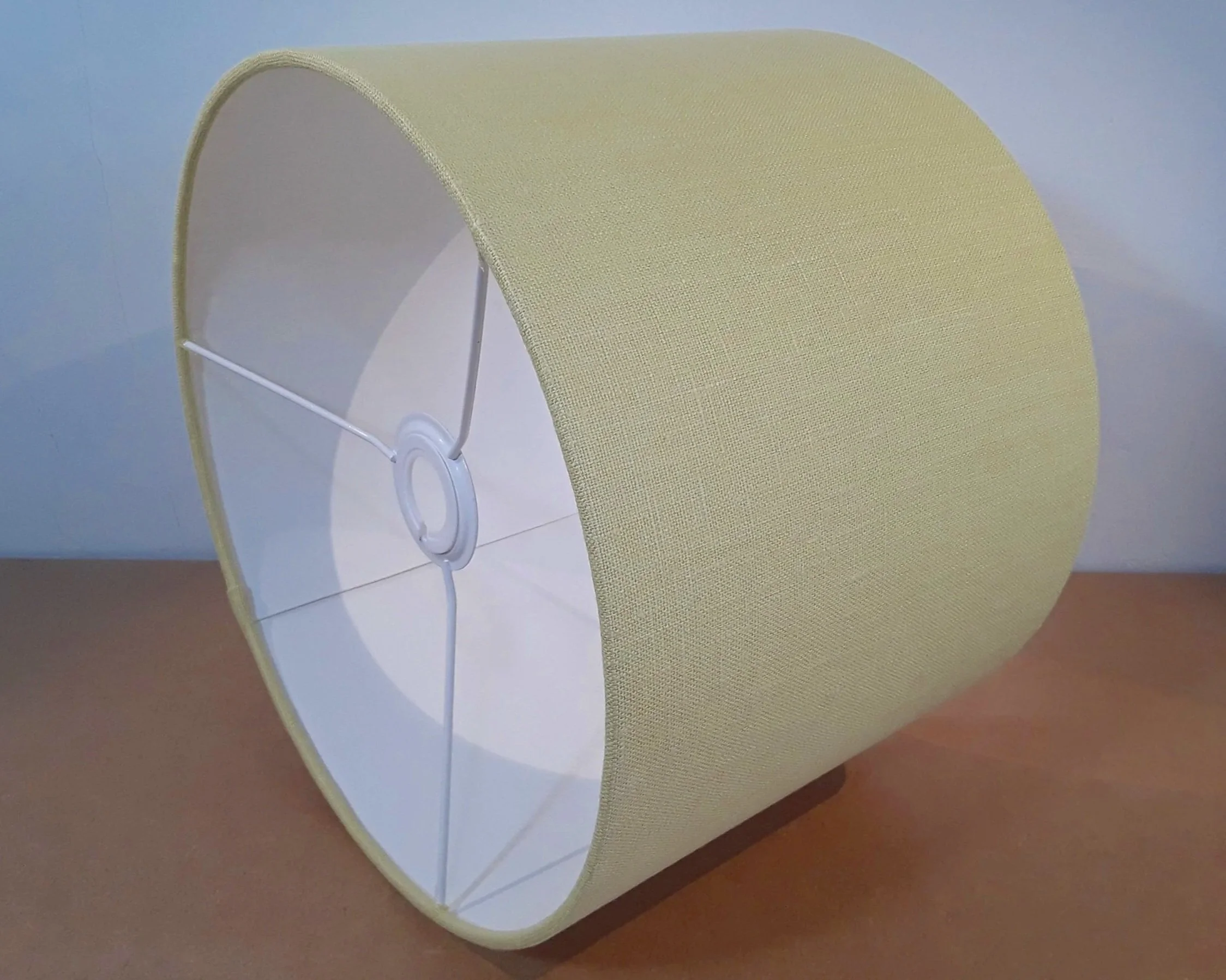Citrus yellow drum lampshade, on its side showing the lamp EU to UK fitiing.