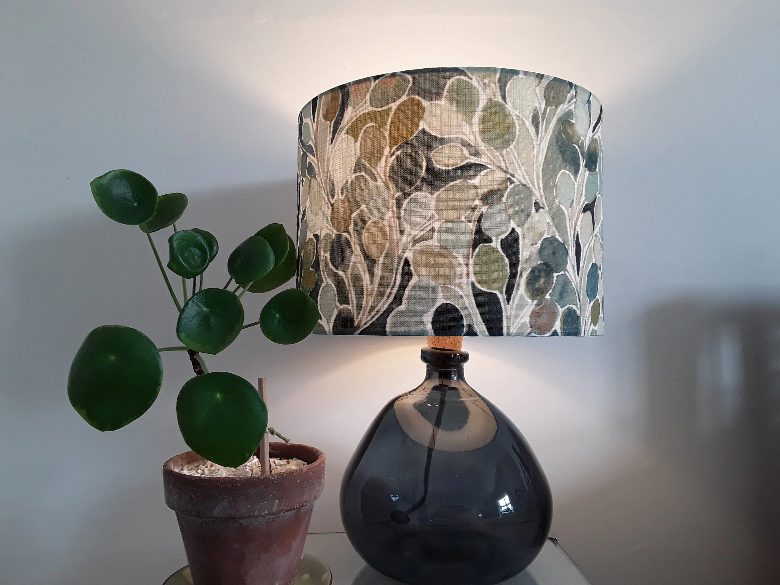 drum lampshade with watercolour leaf design in many shades of green.