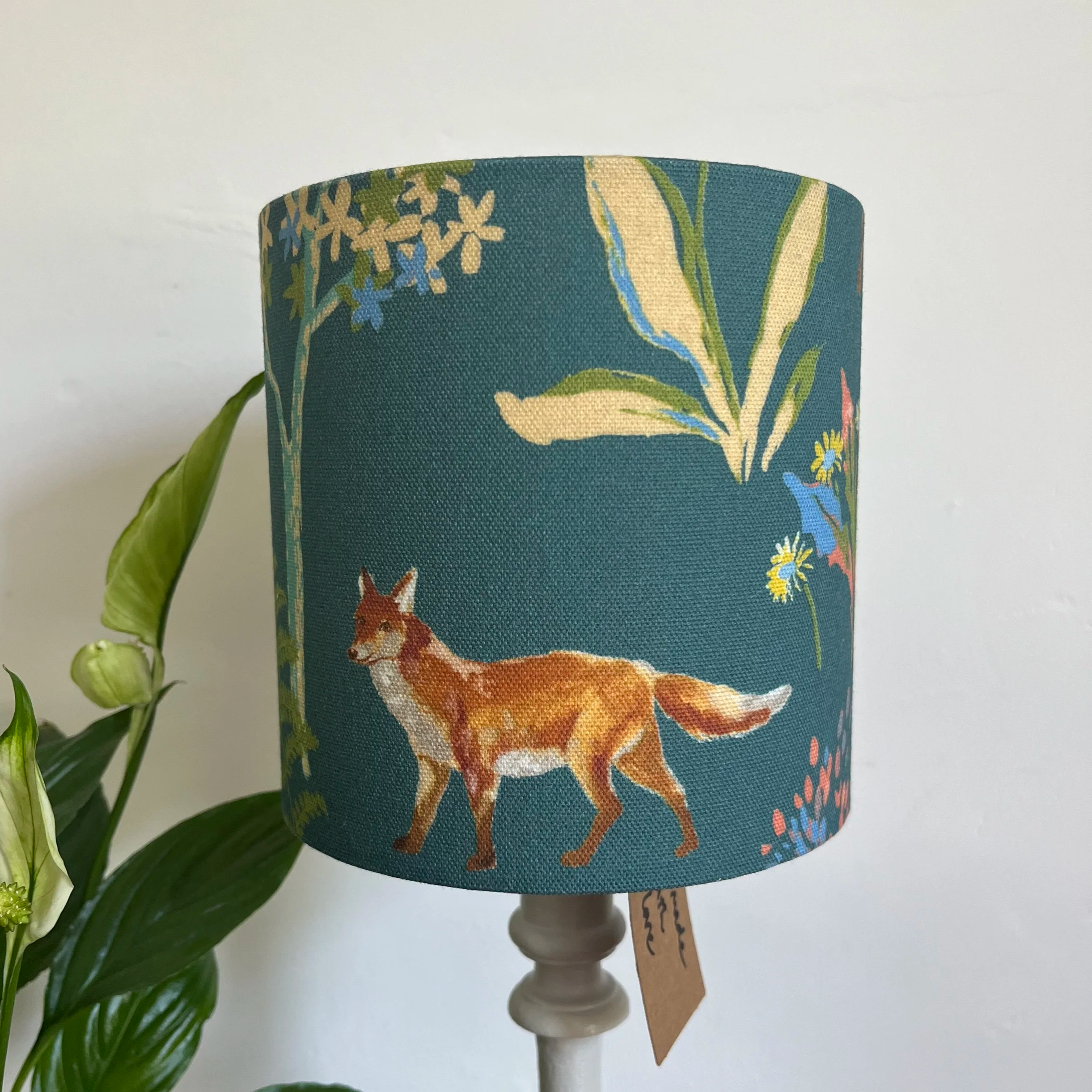 Small drum lampshade featuring a fox and flowers on a teal background.