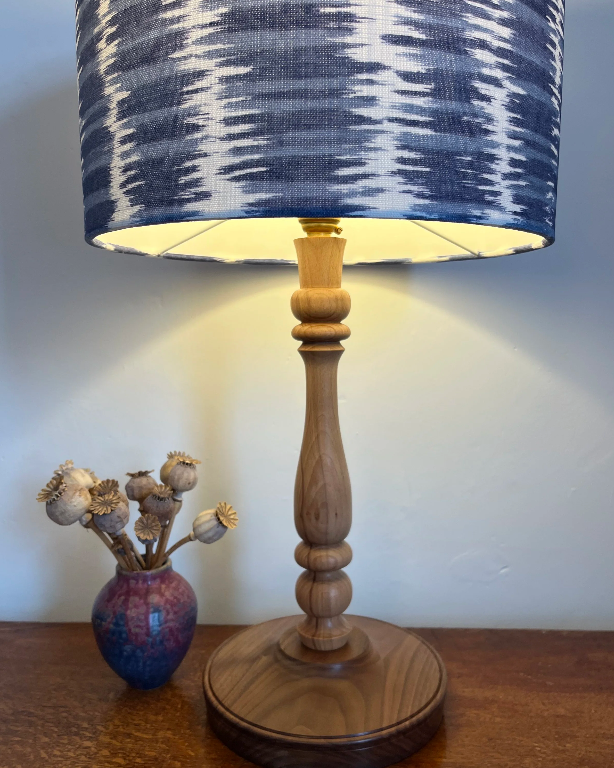 close up of blue and white lampshade with design of ripples on water