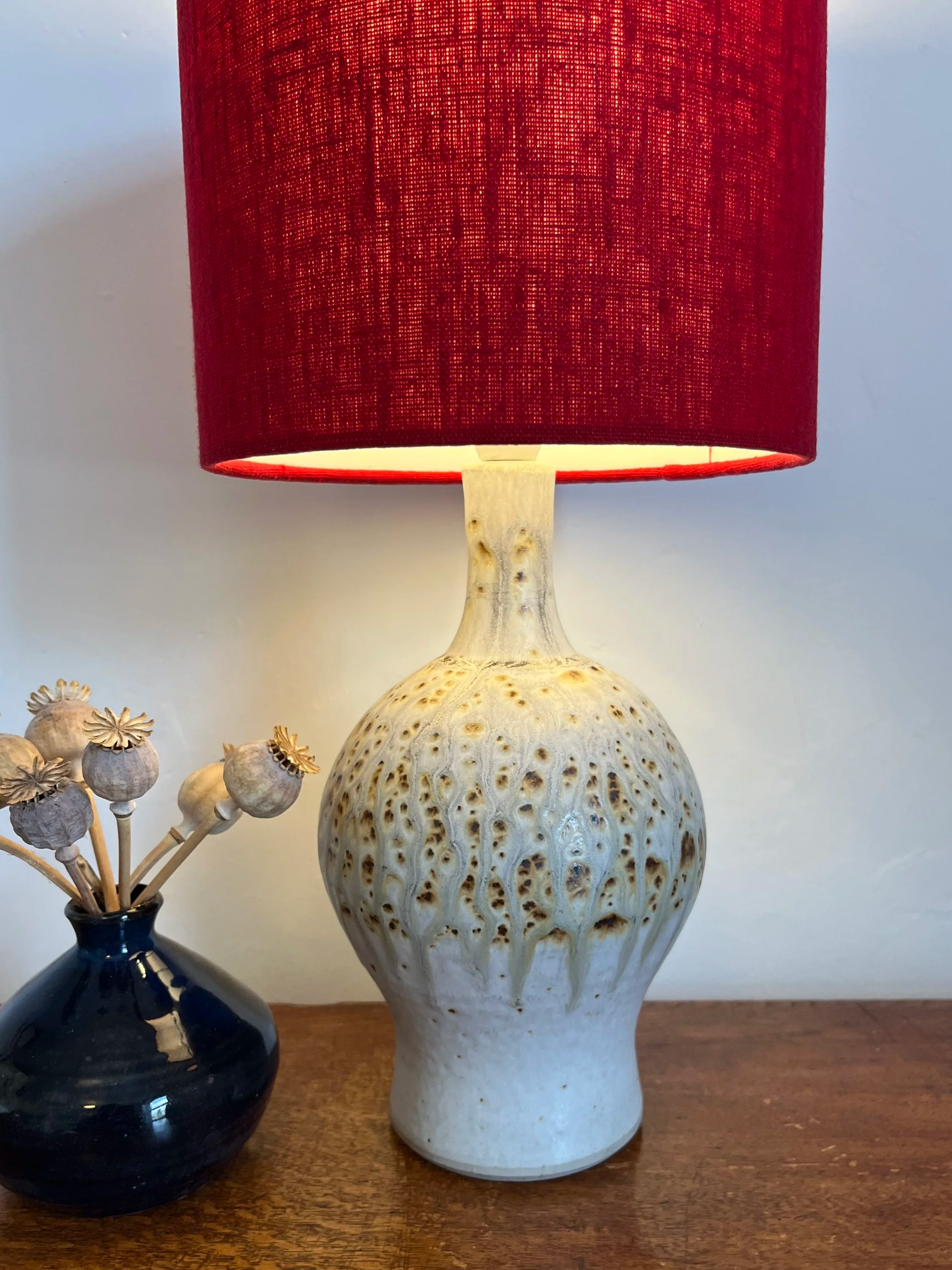 Scarlet red linen lampshade, close up showing texture of fabric.