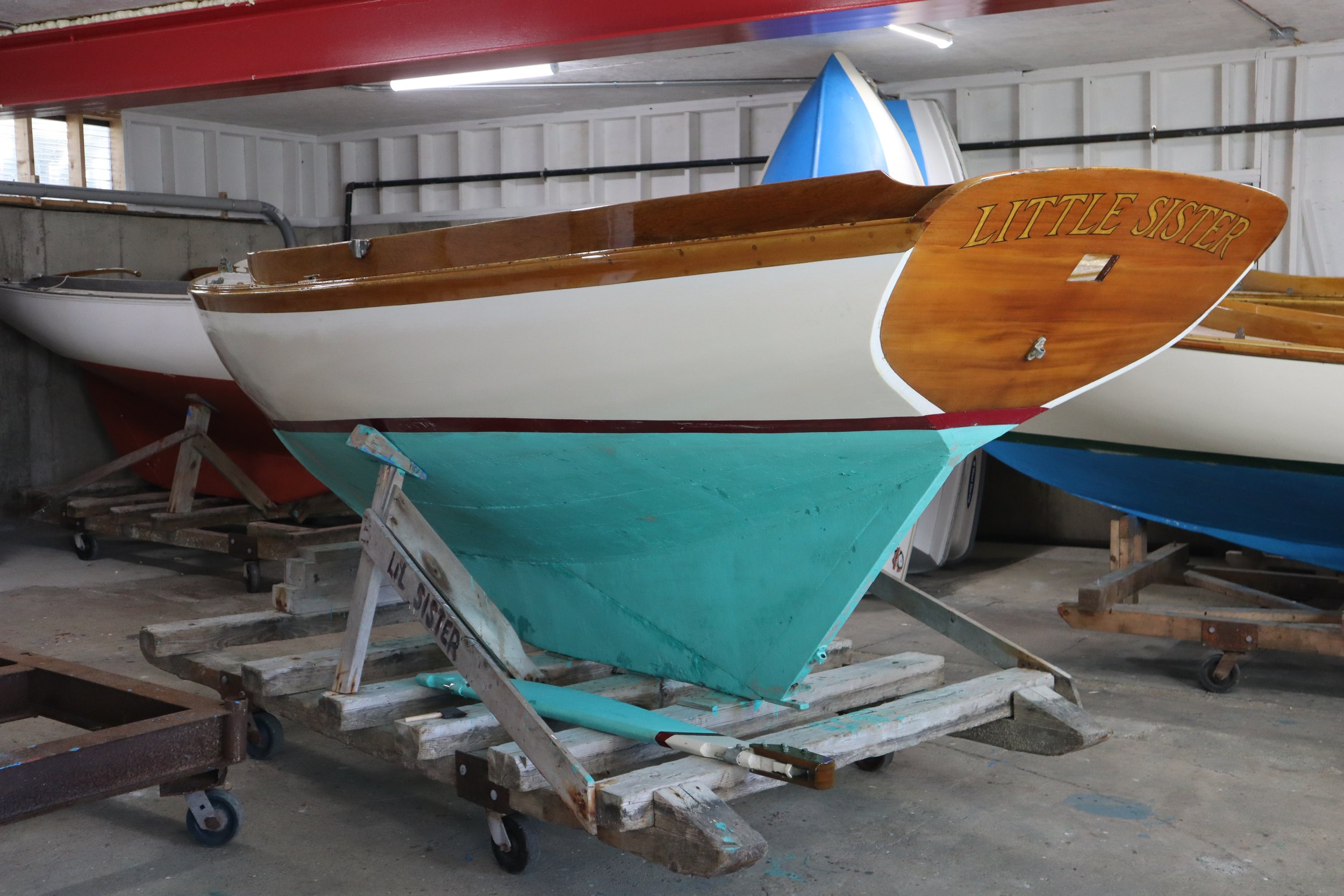 A wooden boat stored in The Factory