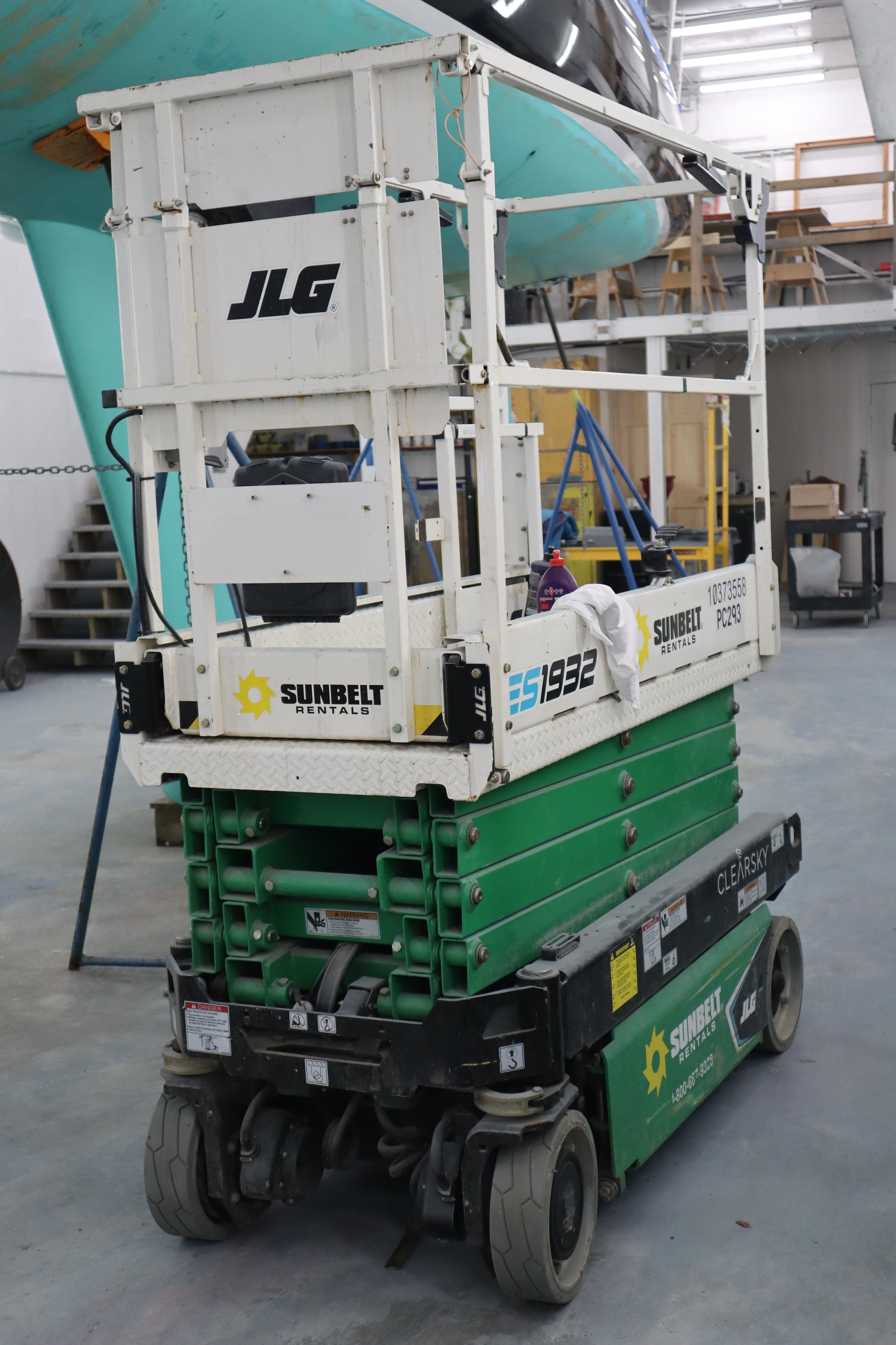  The scissor lift used for painting and reaching the topsides of larger boats. 