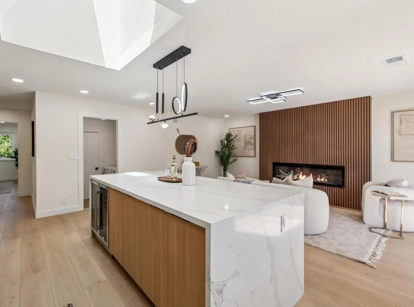 Luxury home staging in Manhattan, New York by White Harmony Design & Staging, featuring a modern neutral kitchen and living room interior.