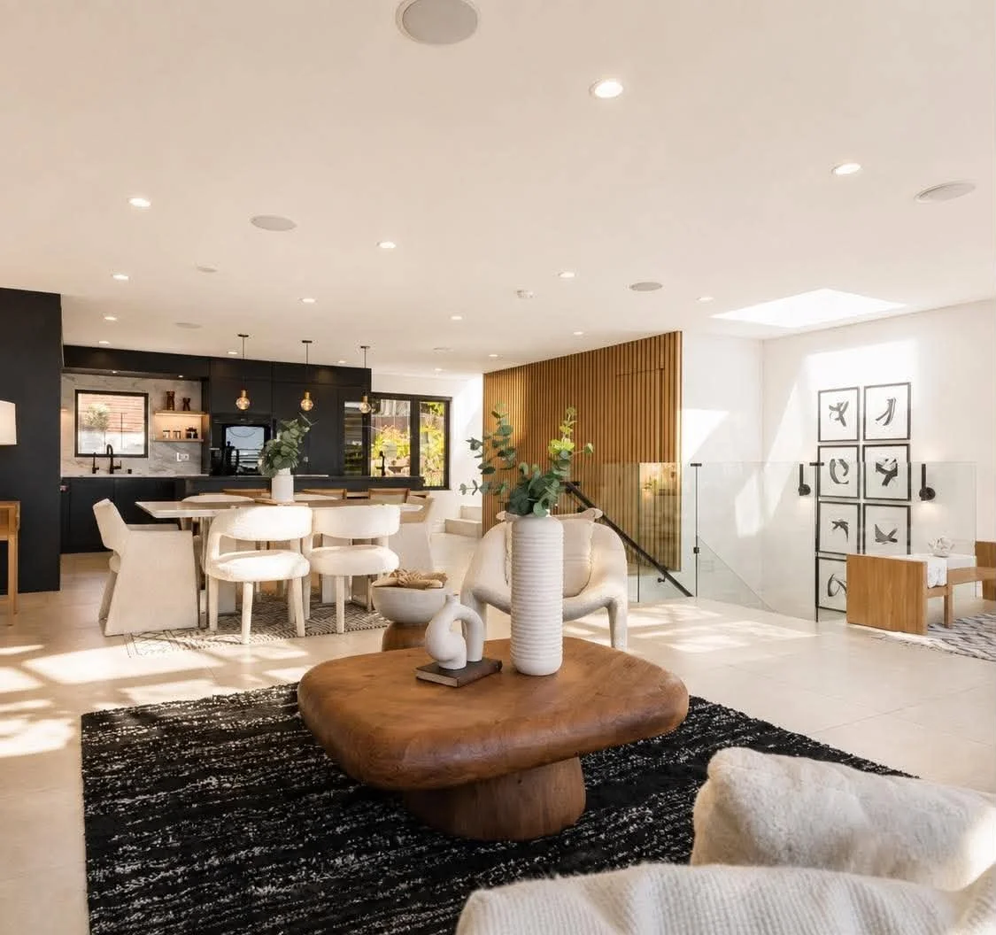 Luxury home staging for a $3 million San Francisco home featuring a modern living room with neutral furniture, natural light