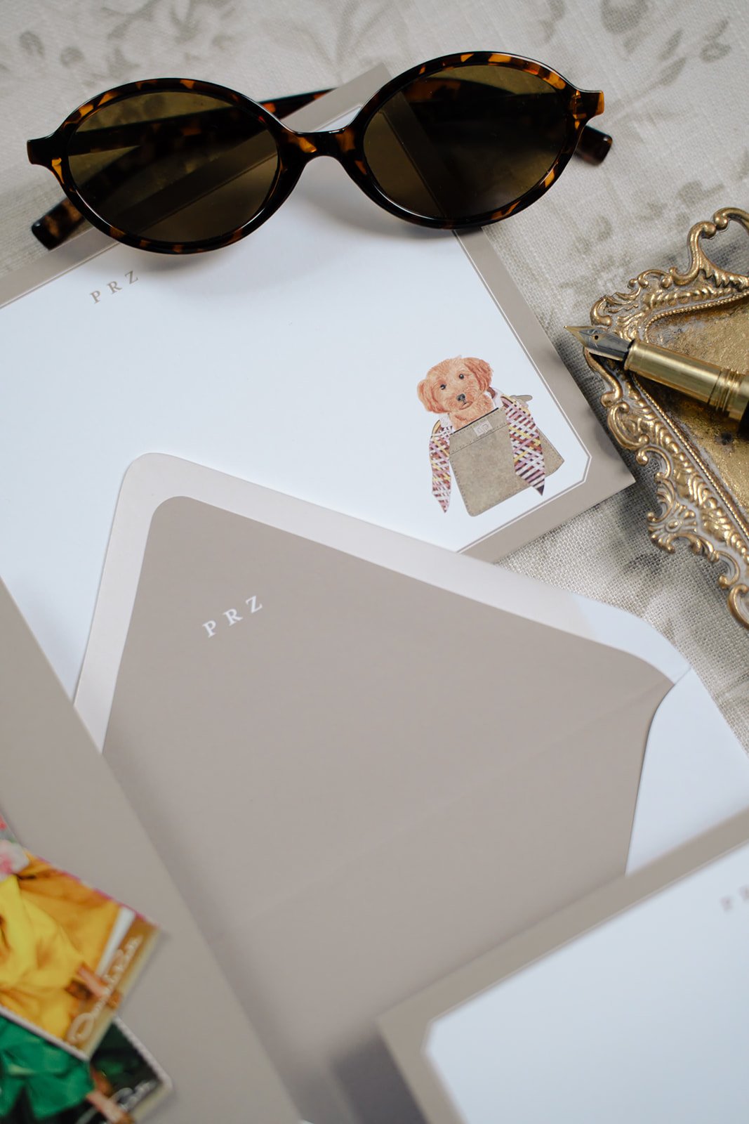 Custom stationery with a golden doodle dog and a Fendi purse