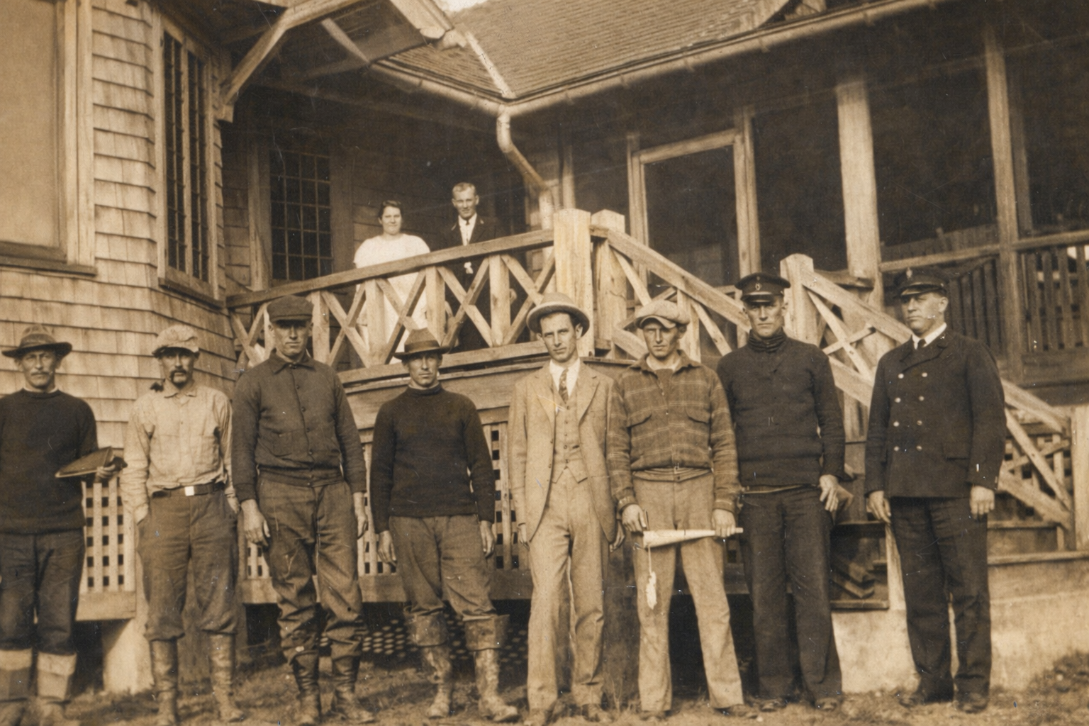 2009.02.006 Smith Island Men standing in front of bungalow.png