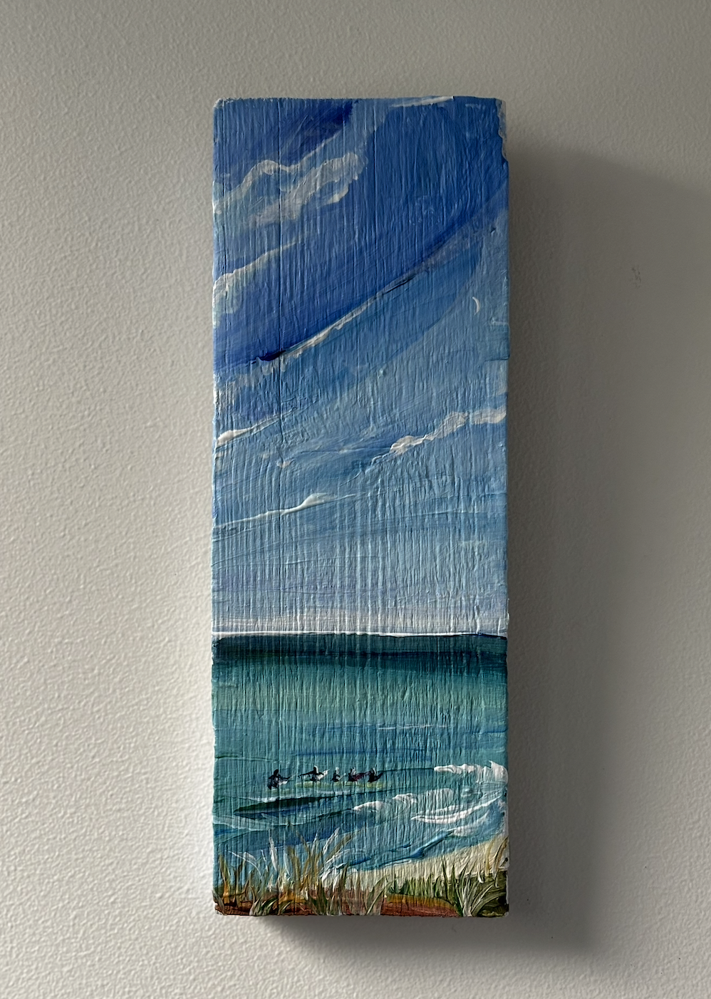 Surfers, acrylic on driftwood, 2025