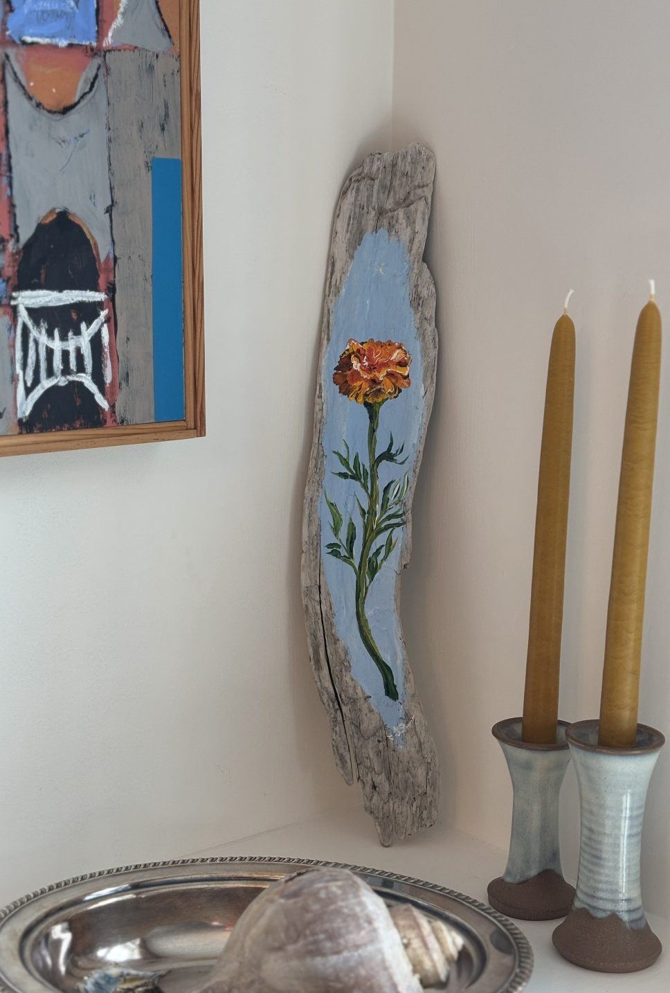 Marigold Magic, acrylic on driftwood, 2025