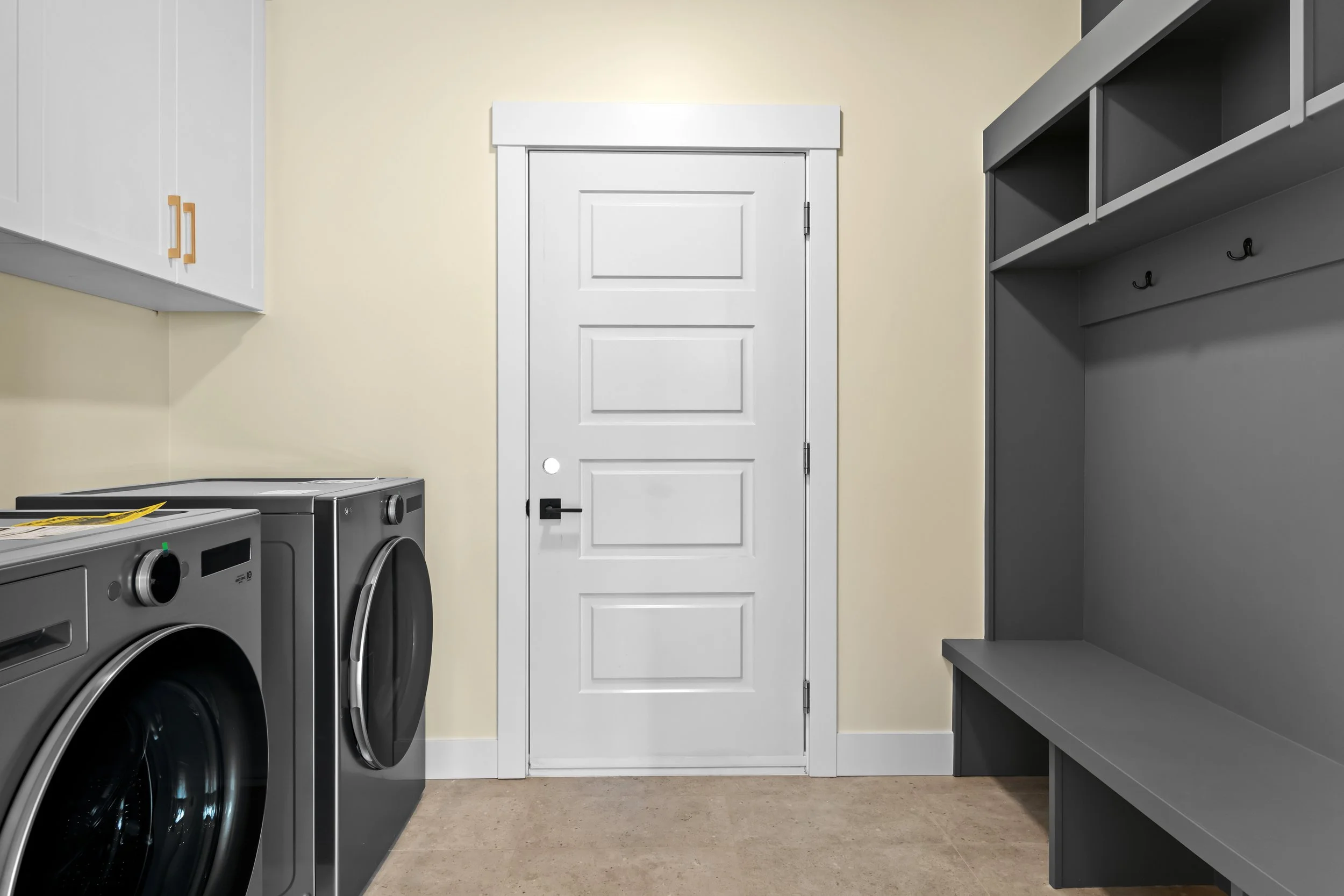 Laundry room and mud room conveniently located between garage and main living area