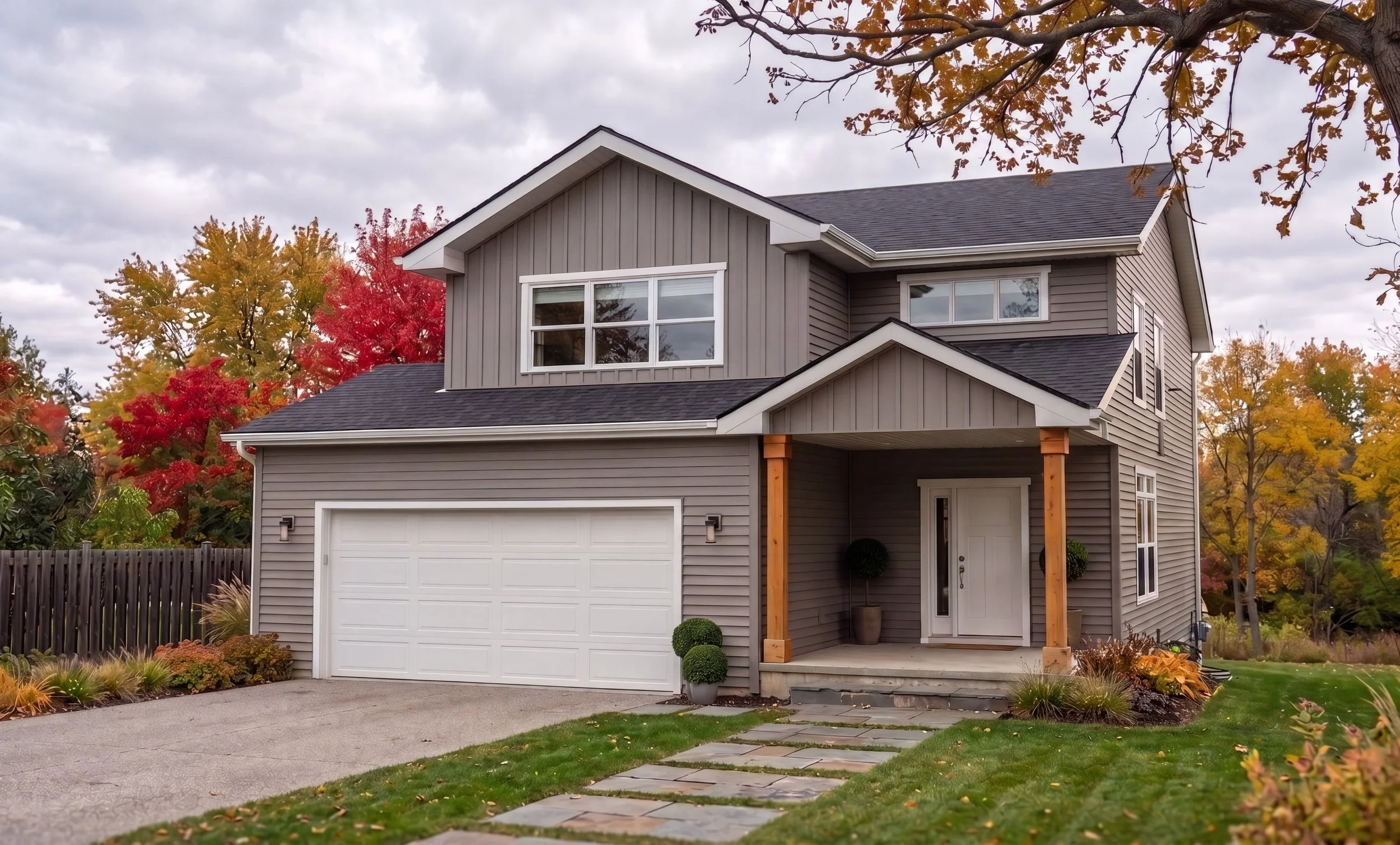 Home builder custom design two storey home metal roof stone