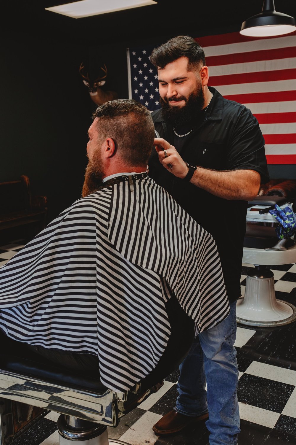 Barber at work on a client Hendersonville NC barbershop