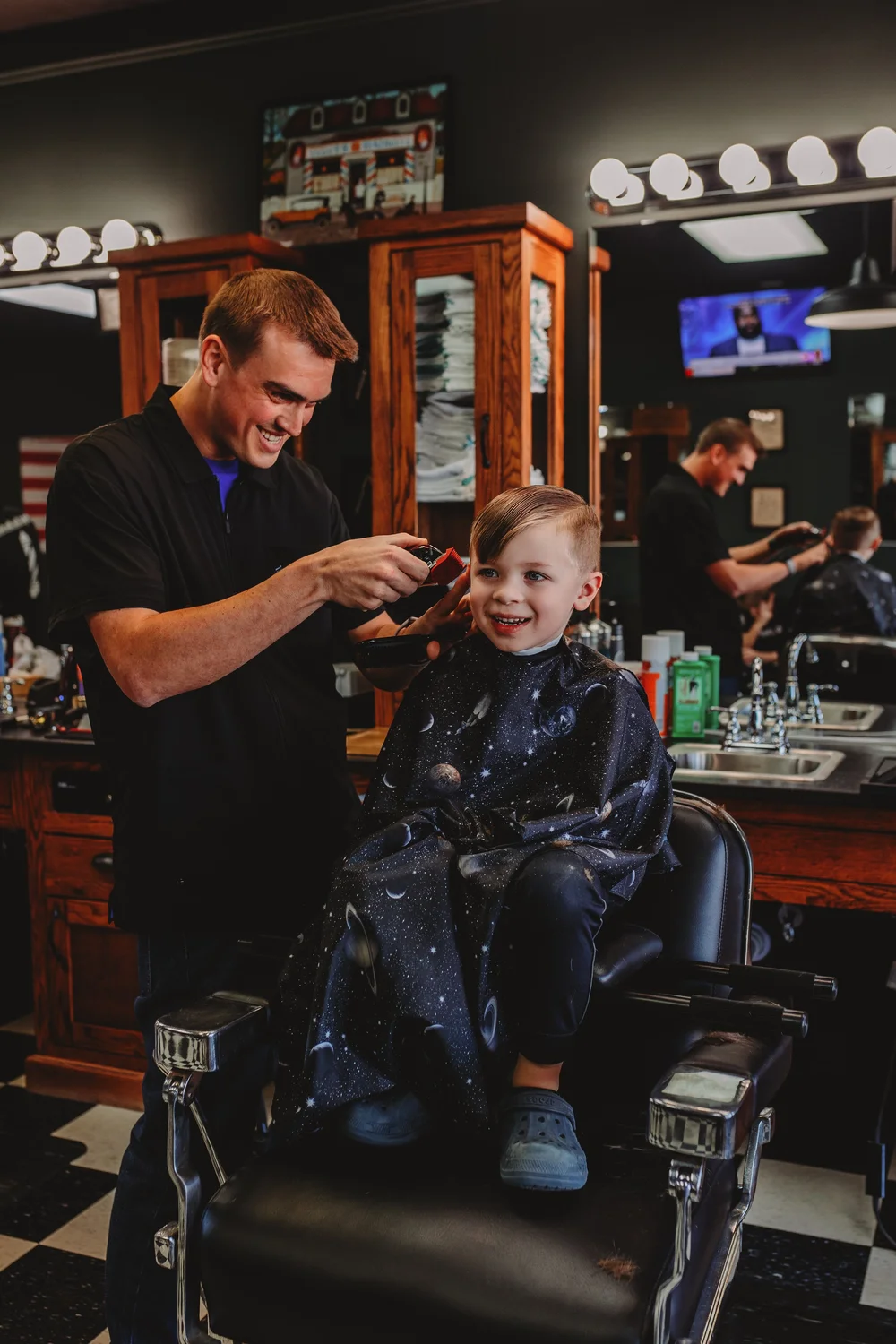 Barber crafting a skin fade Three Hounds Barbershop NC
