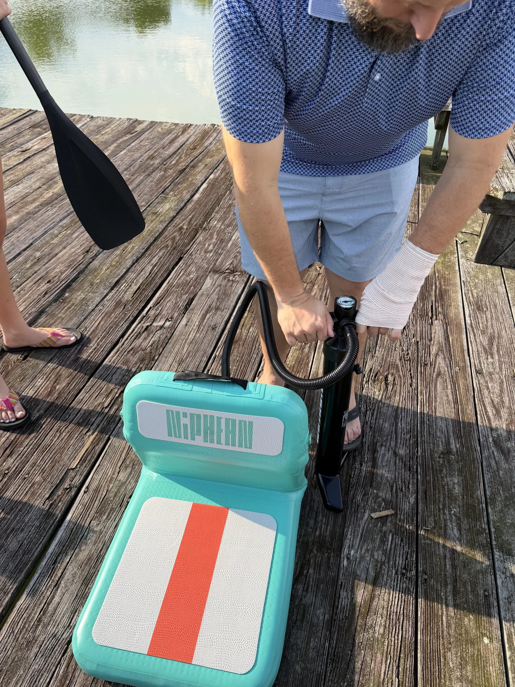 The author's husband inflating the attachable seat