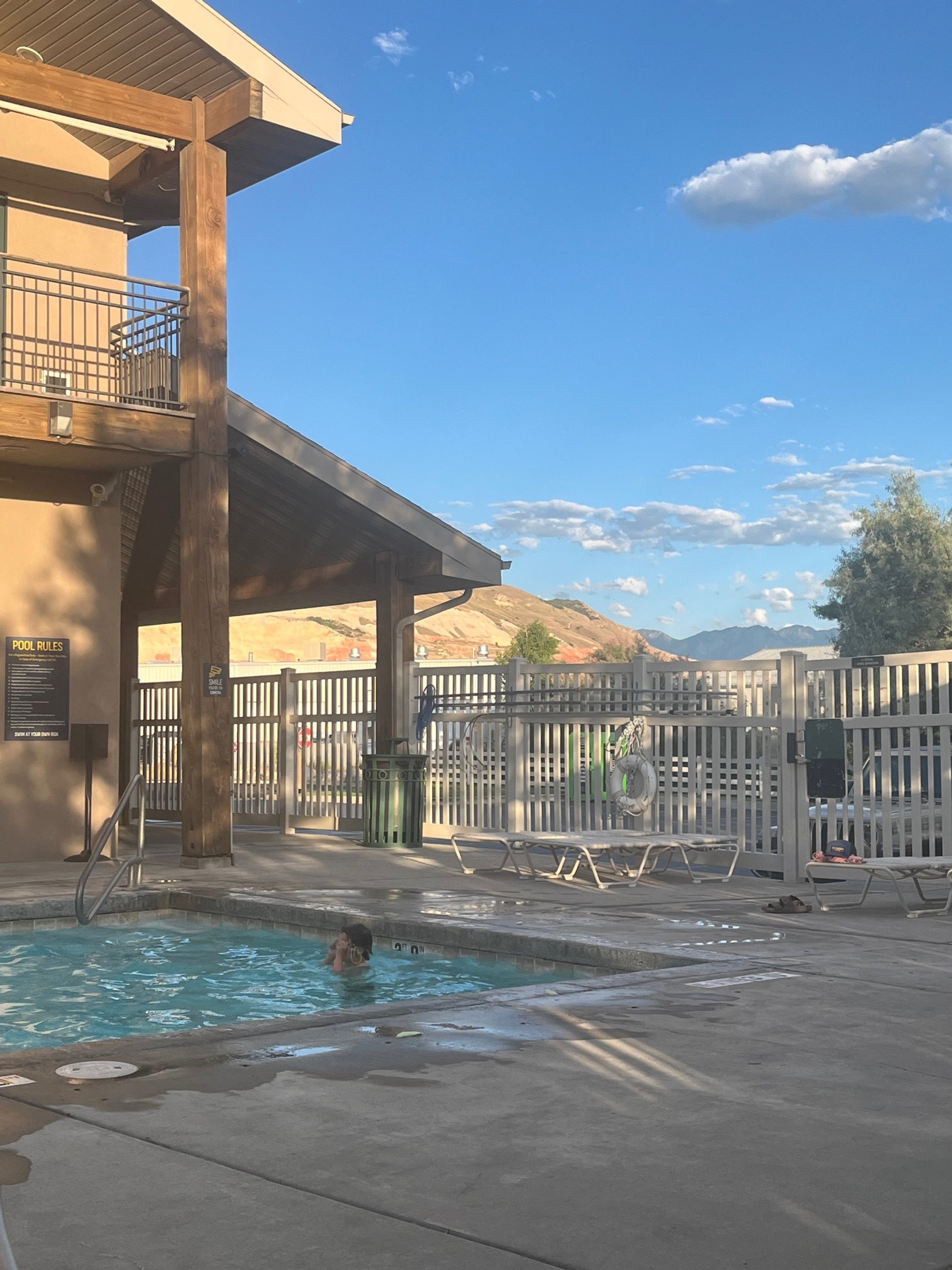 The author's son plays in the pool at the campground