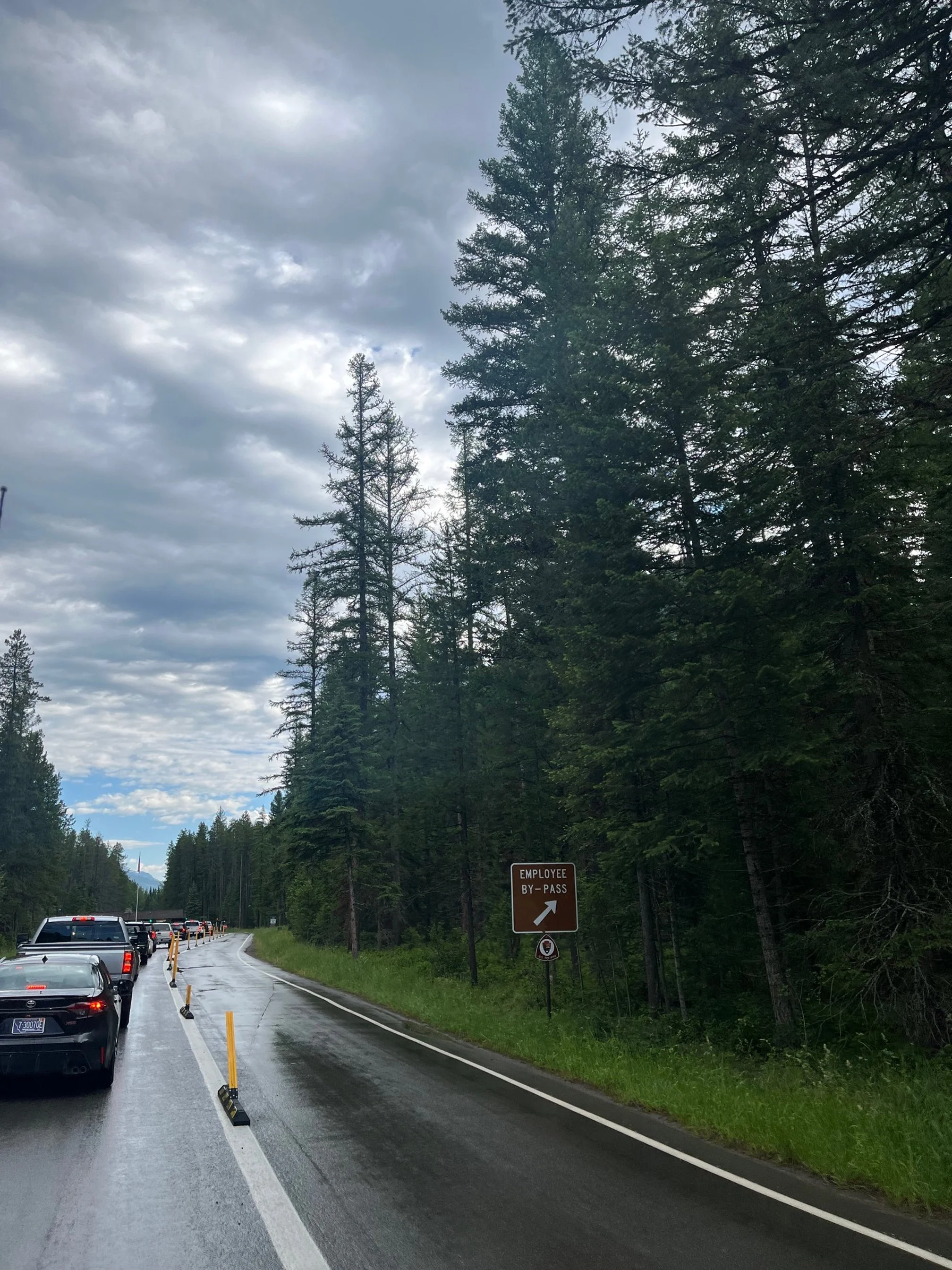 Cars line up at the entrance to Glacier National Park