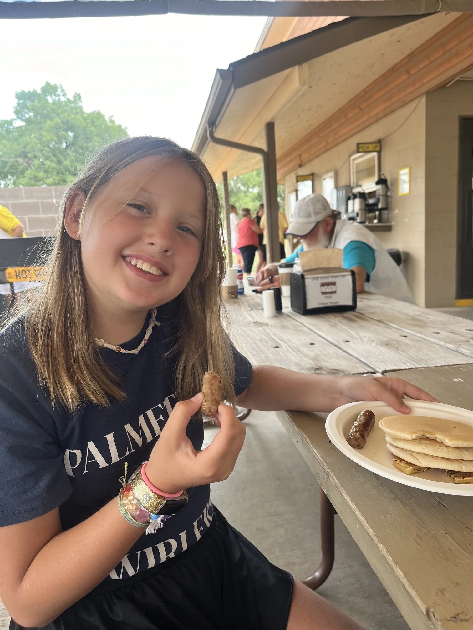 The author's daughter at the campground's daily pancake breakfast
