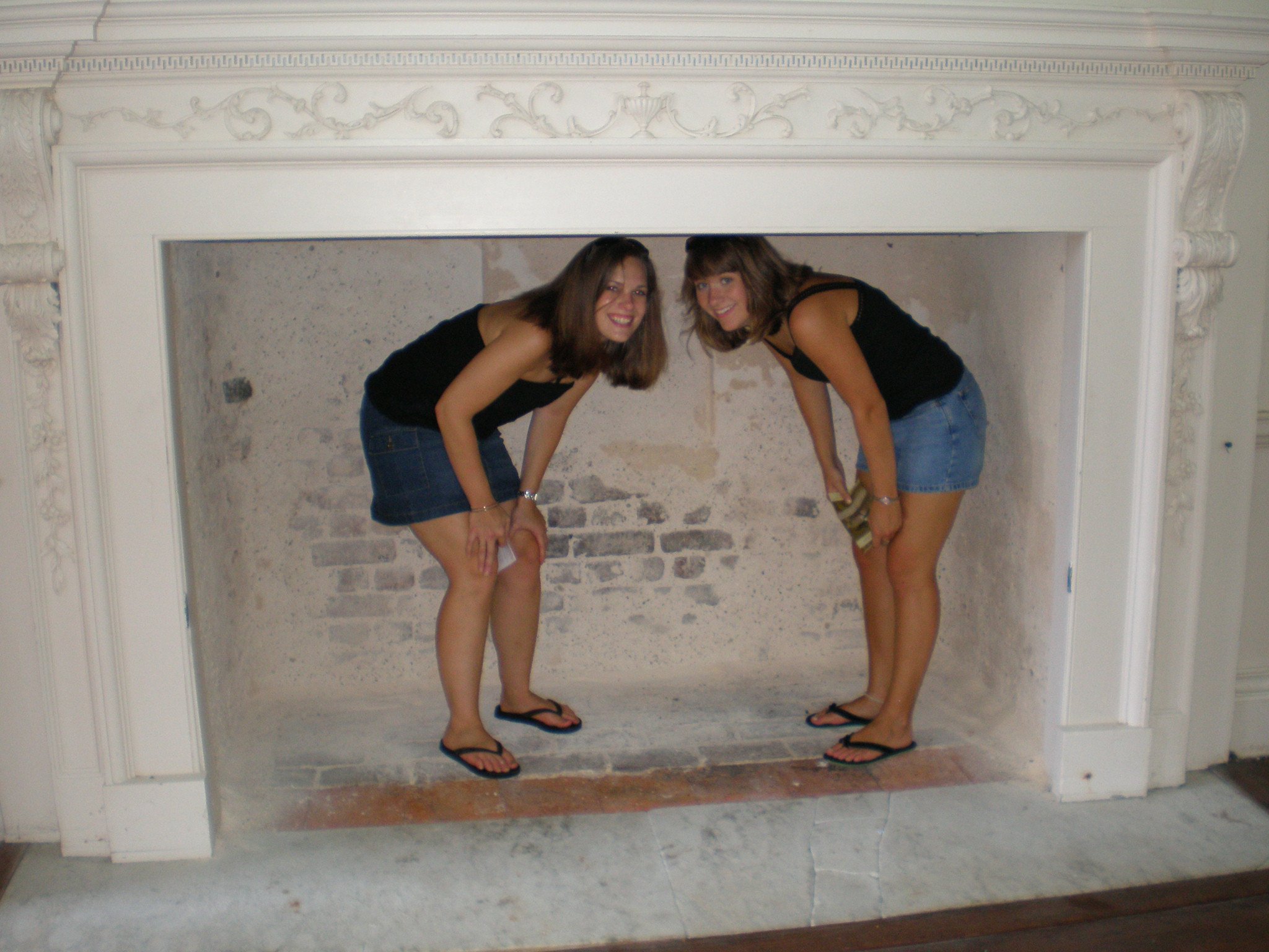 My cousin and sister in the big fireplace