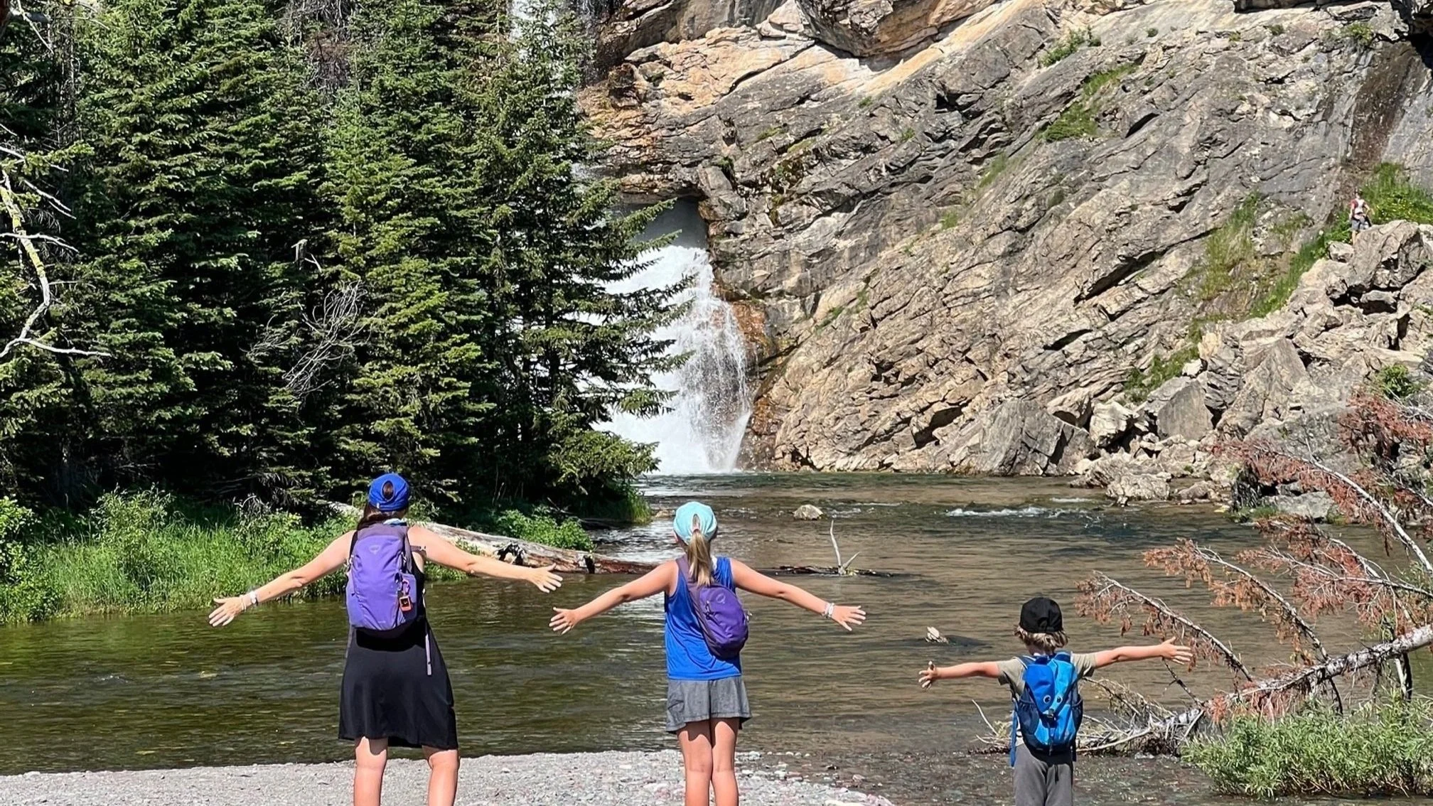 The author and her children at Running Eagle Falls in Glacier National Park