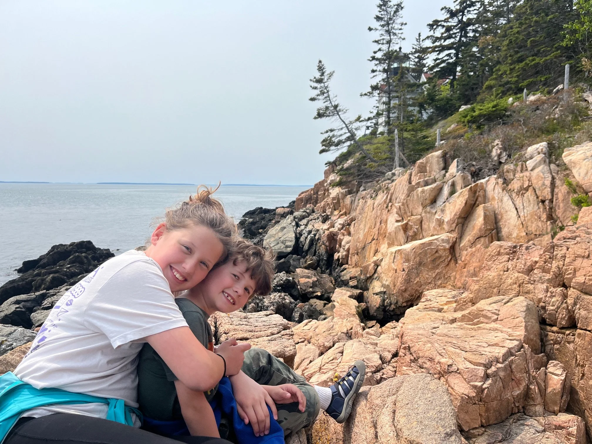 The author's kids on the shores below the Bass Harbord Head LIghthouse