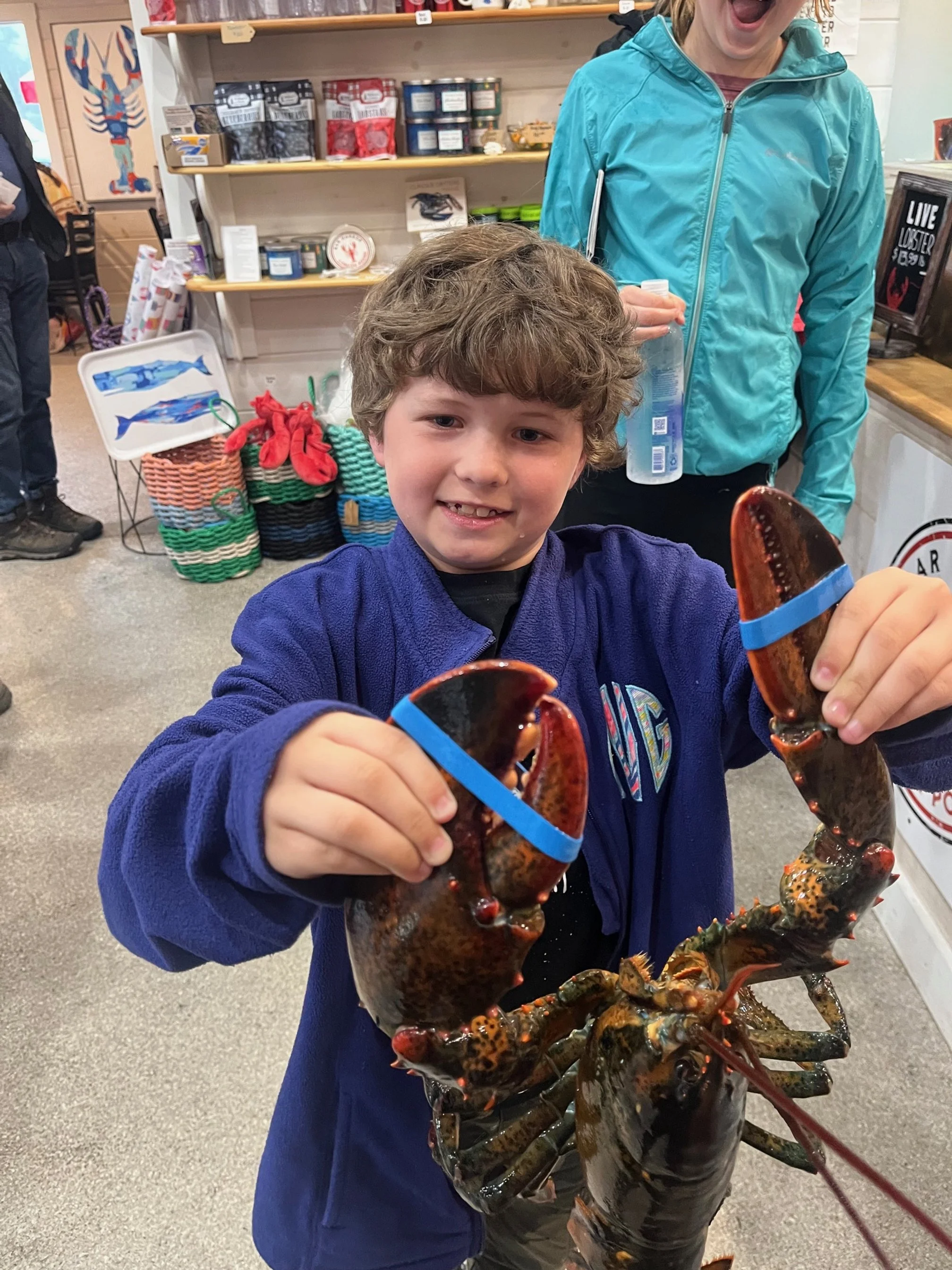ultimate-acadia-national-park-itinerary-boy-holding-lobster.jpg