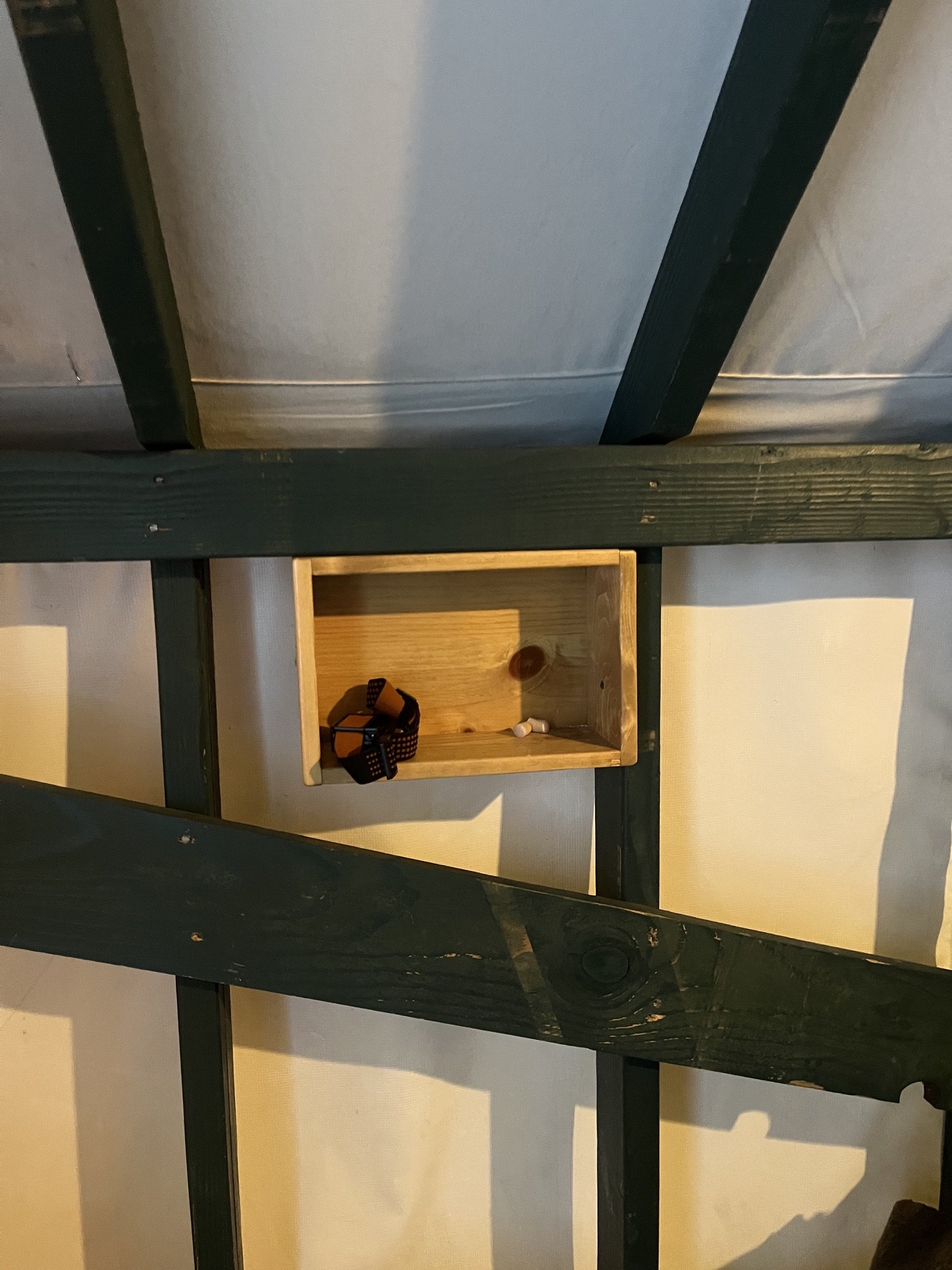 The one small shelf near the beds